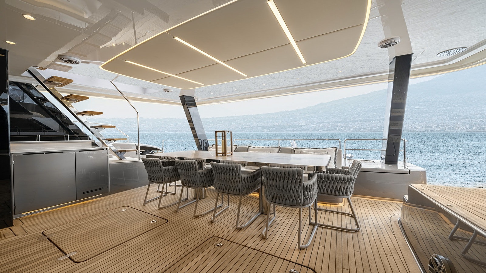 a room with a table and chairs aboard AMILEO Yacht for Charter