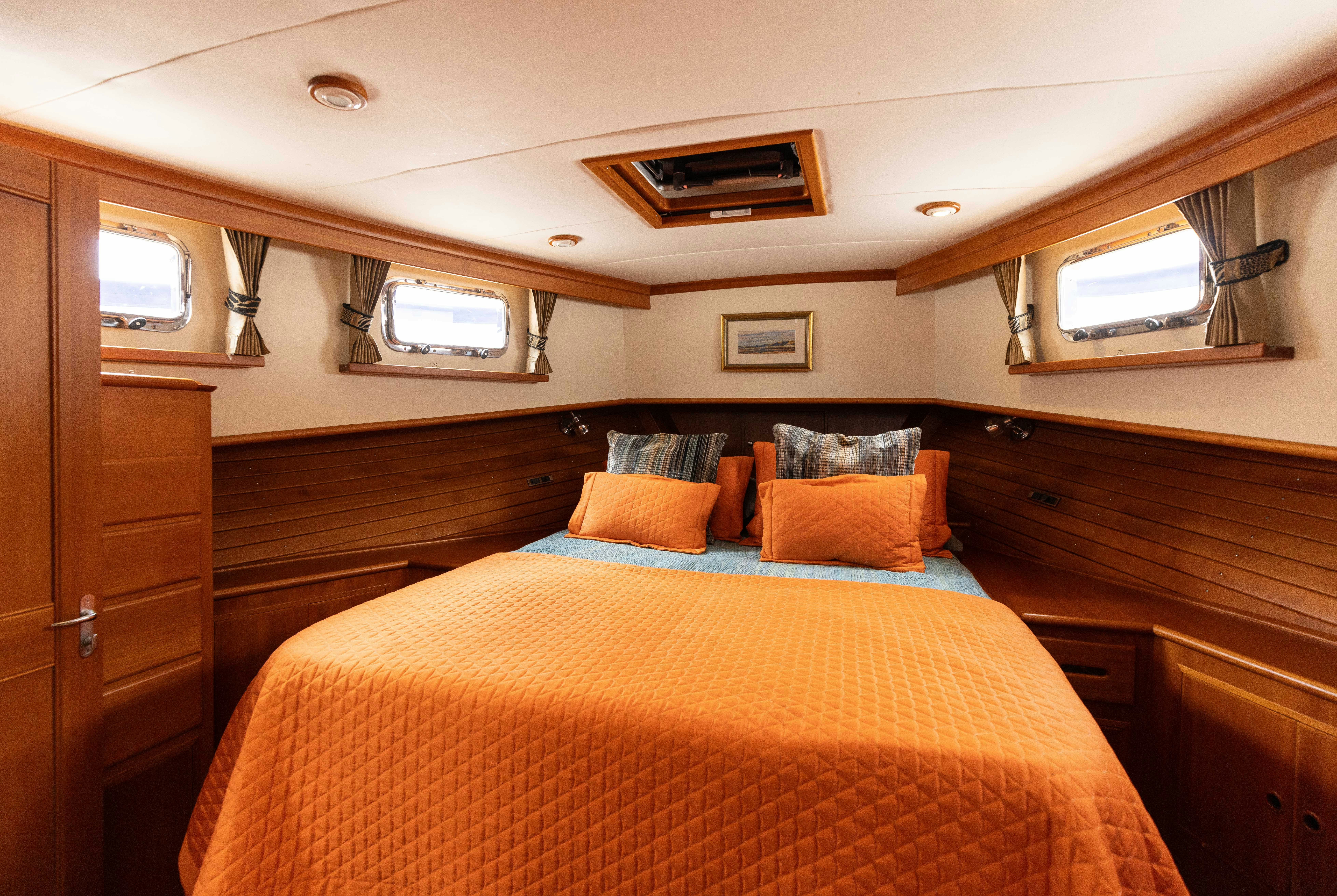 a bed in a cabin aboard INDABA Yacht for Sale