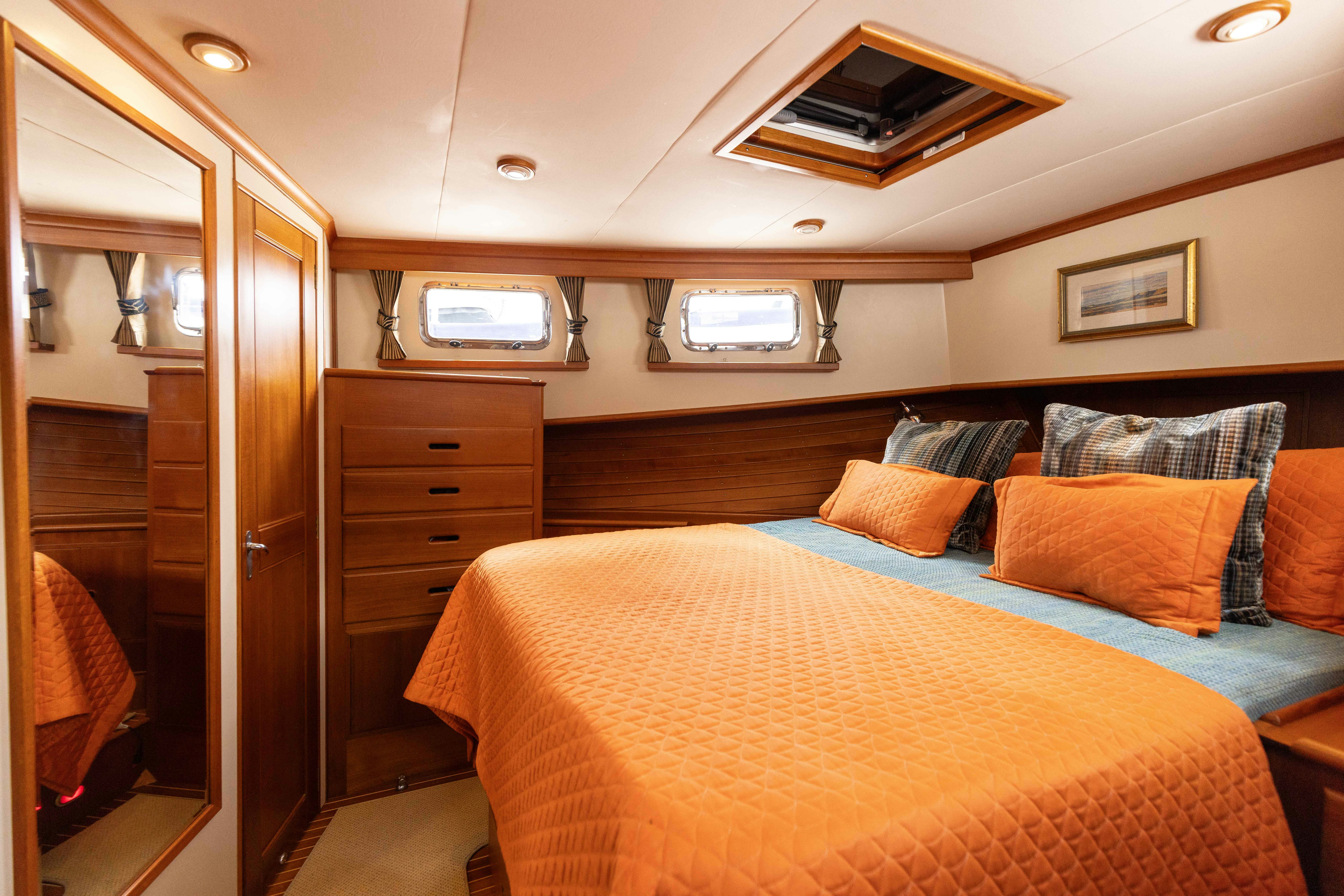 a bed in a room aboard INDABA Yacht for Sale
