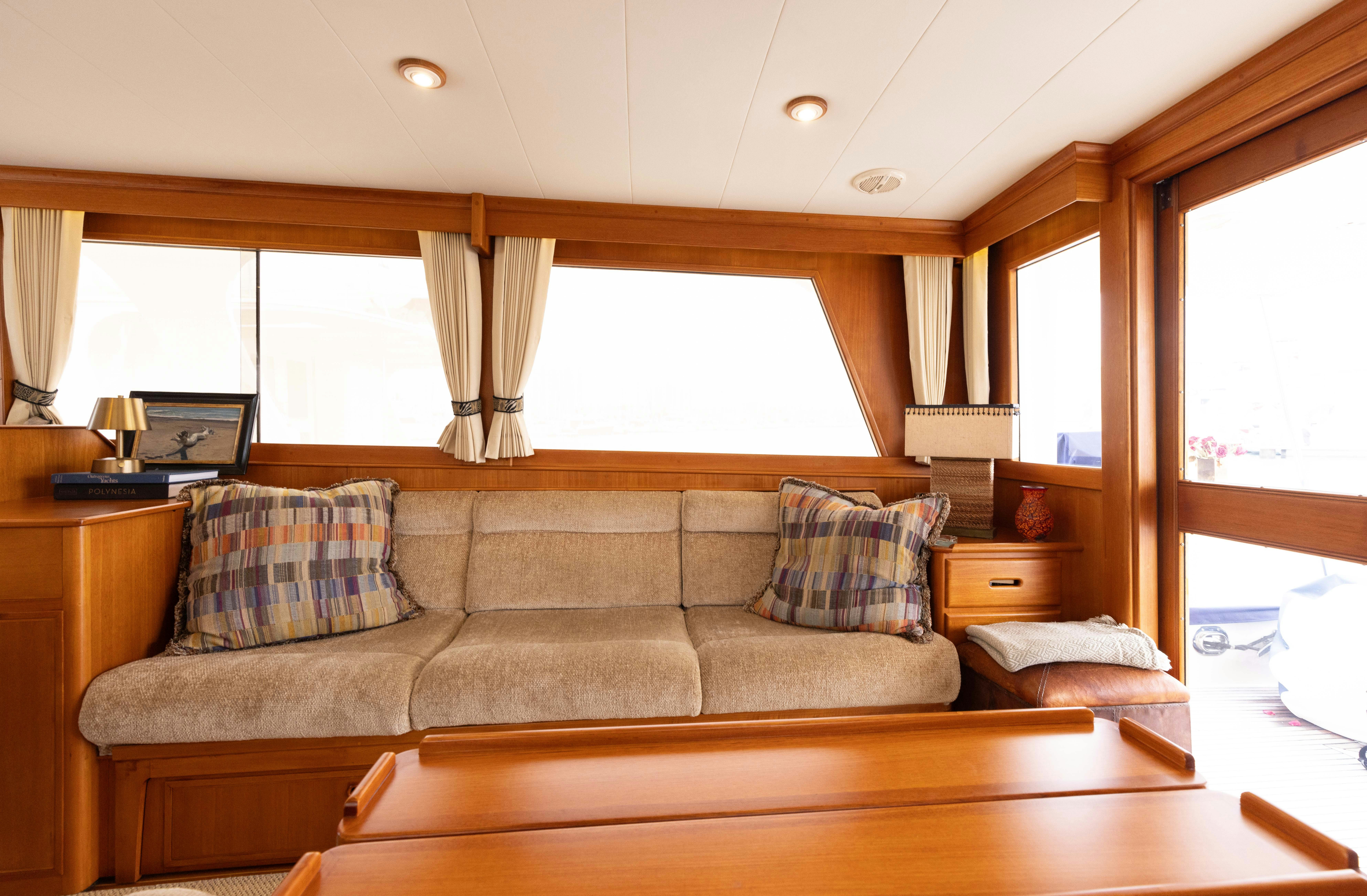 a living room with a couch aboard INDABA Yacht for Sale
