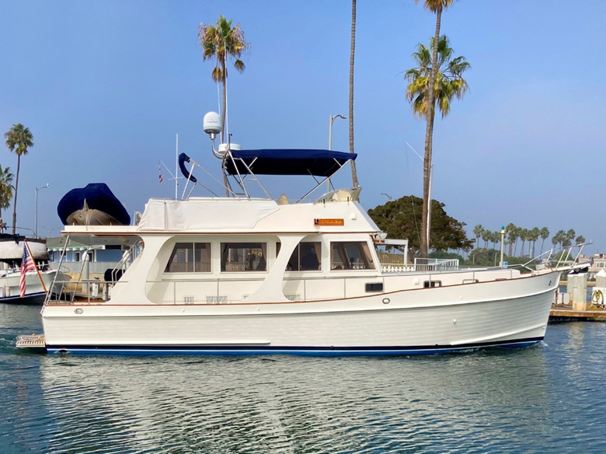 a white yacht in the water aboard INDABA Yacht for Sale