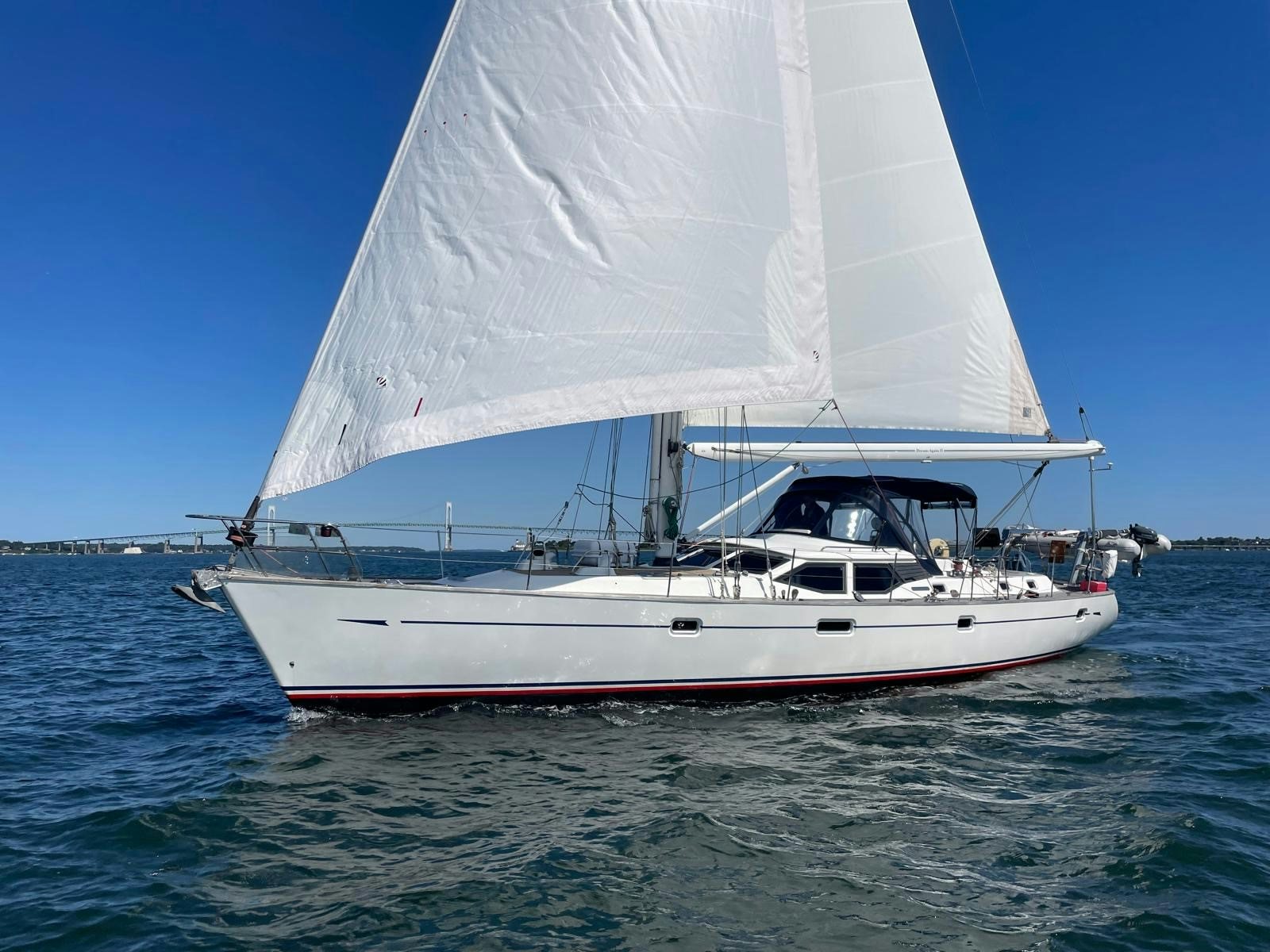 a white boat on the water aboard DREAM AGAIN II Yacht for Sale