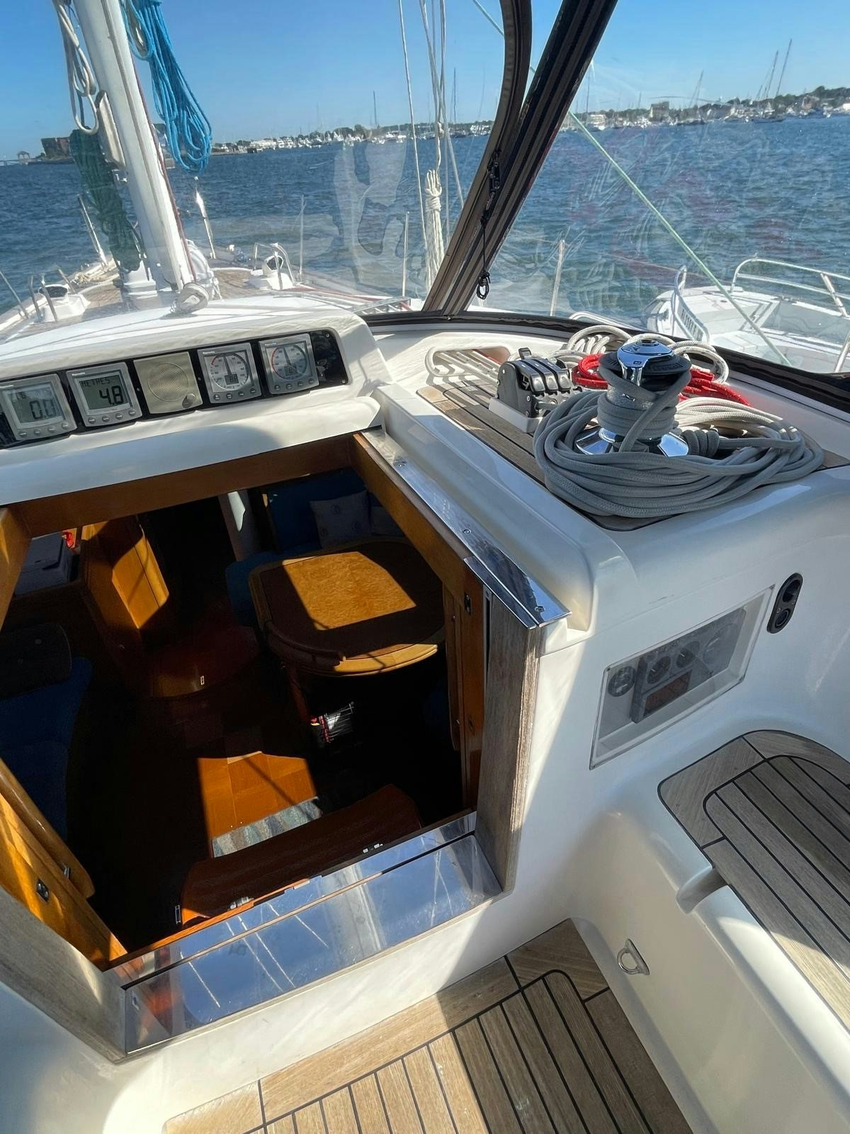 a boat with a view of the water and a city below aboard DREAM AGAIN II Yacht for Sale
