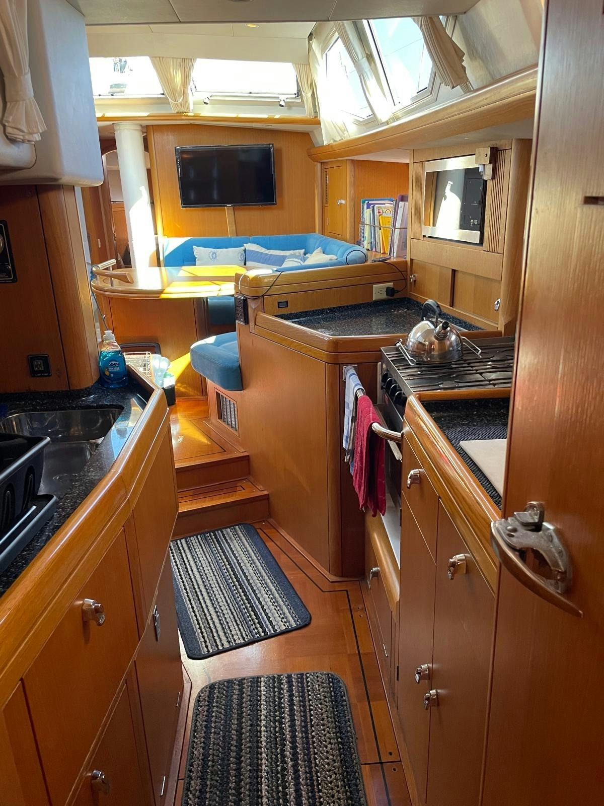 a kitchen with a stove and a sink aboard DREAM AGAIN II Yacht for Sale
