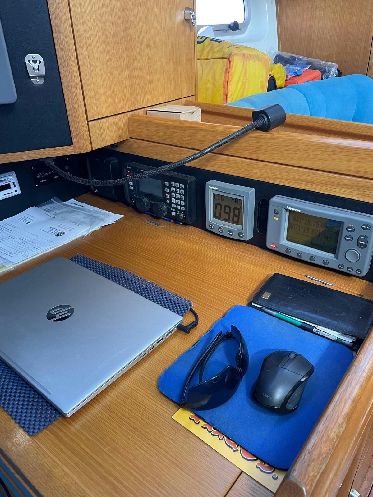 a desk with a laptop and a mouse on it aboard DREAM AGAIN II Yacht for Sale