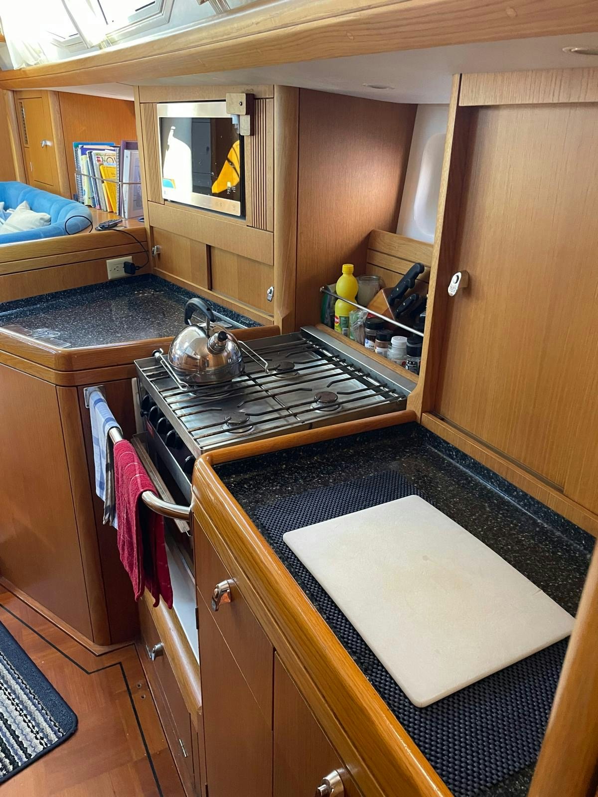 a kitchen with a sink and a microwave aboard DREAM AGAIN II Yacht for Sale