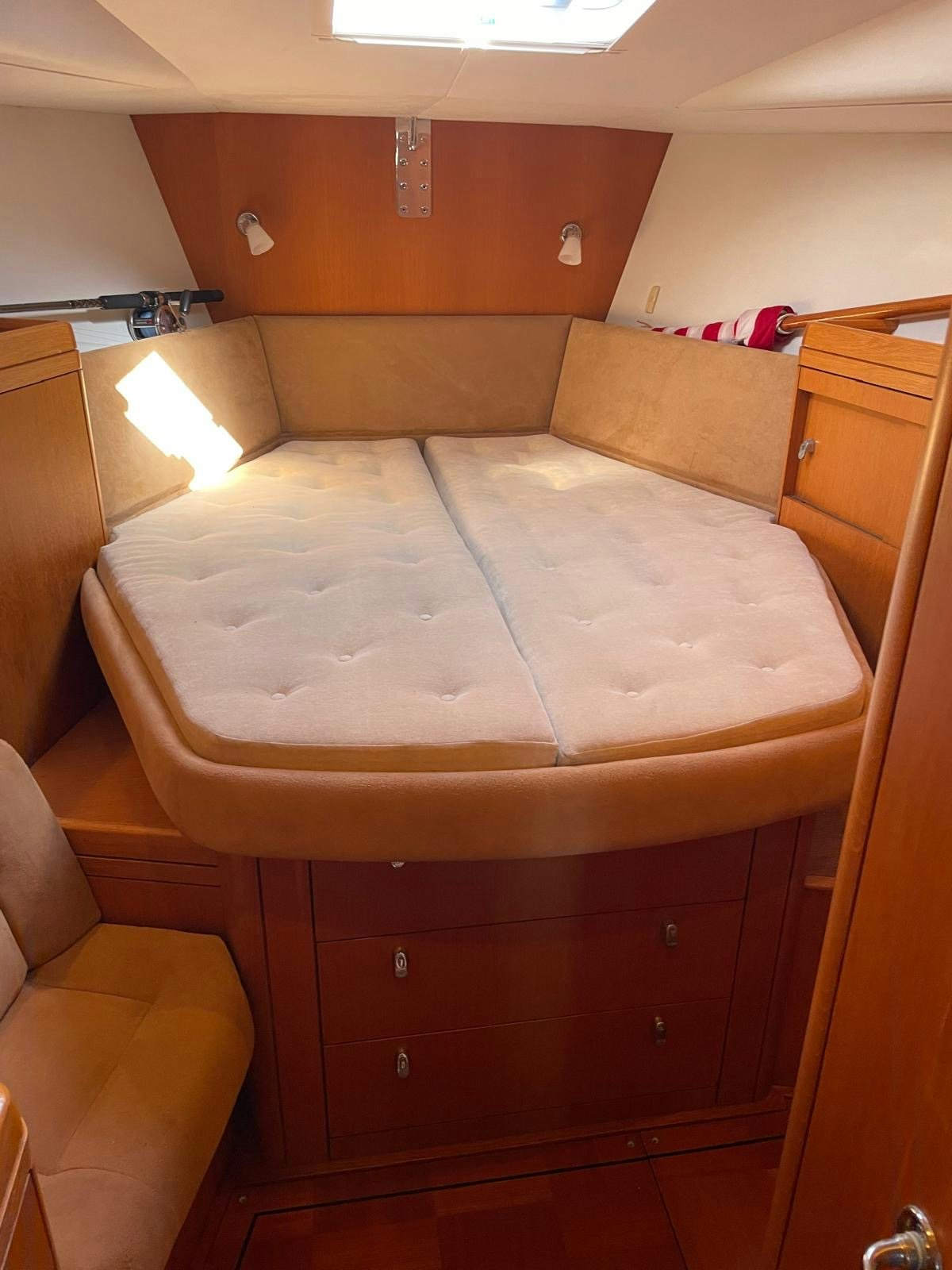 a bed with a white sheet aboard DREAM AGAIN II Yacht for Sale