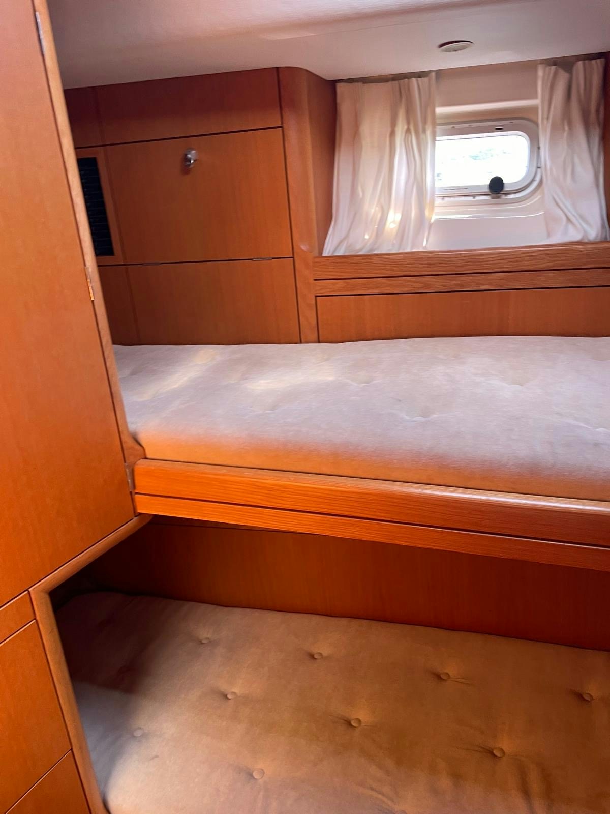 a wooden cabinet in a room aboard DREAM AGAIN II Yacht for Sale