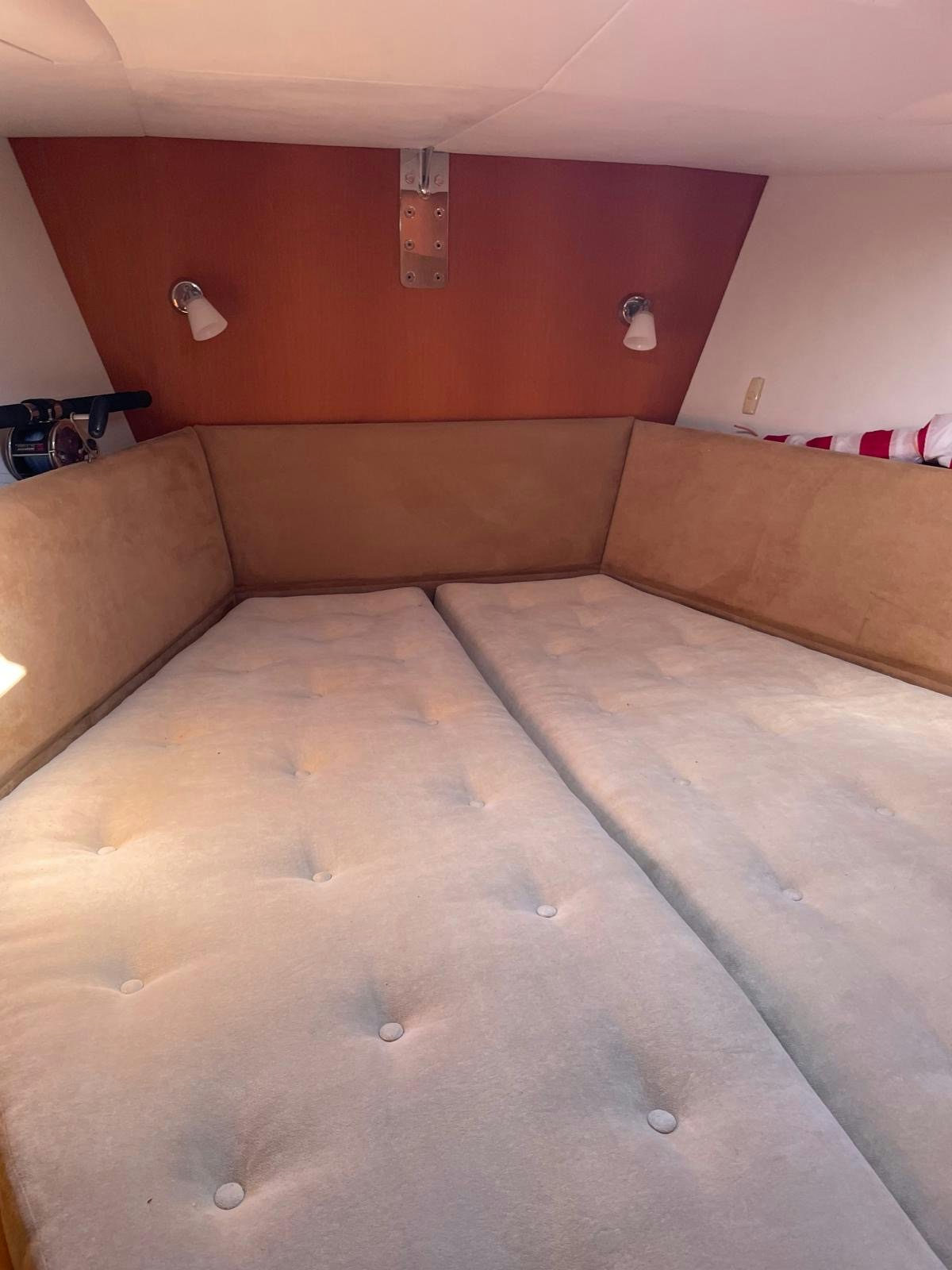 a brown couch in a room aboard DREAM AGAIN II Yacht for Sale