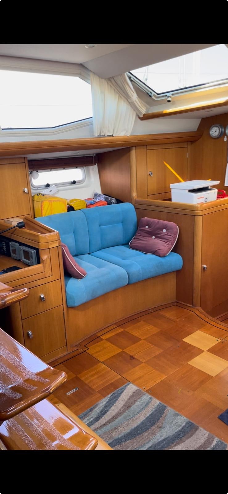 a couch in a room aboard DREAM AGAIN II Yacht for Sale