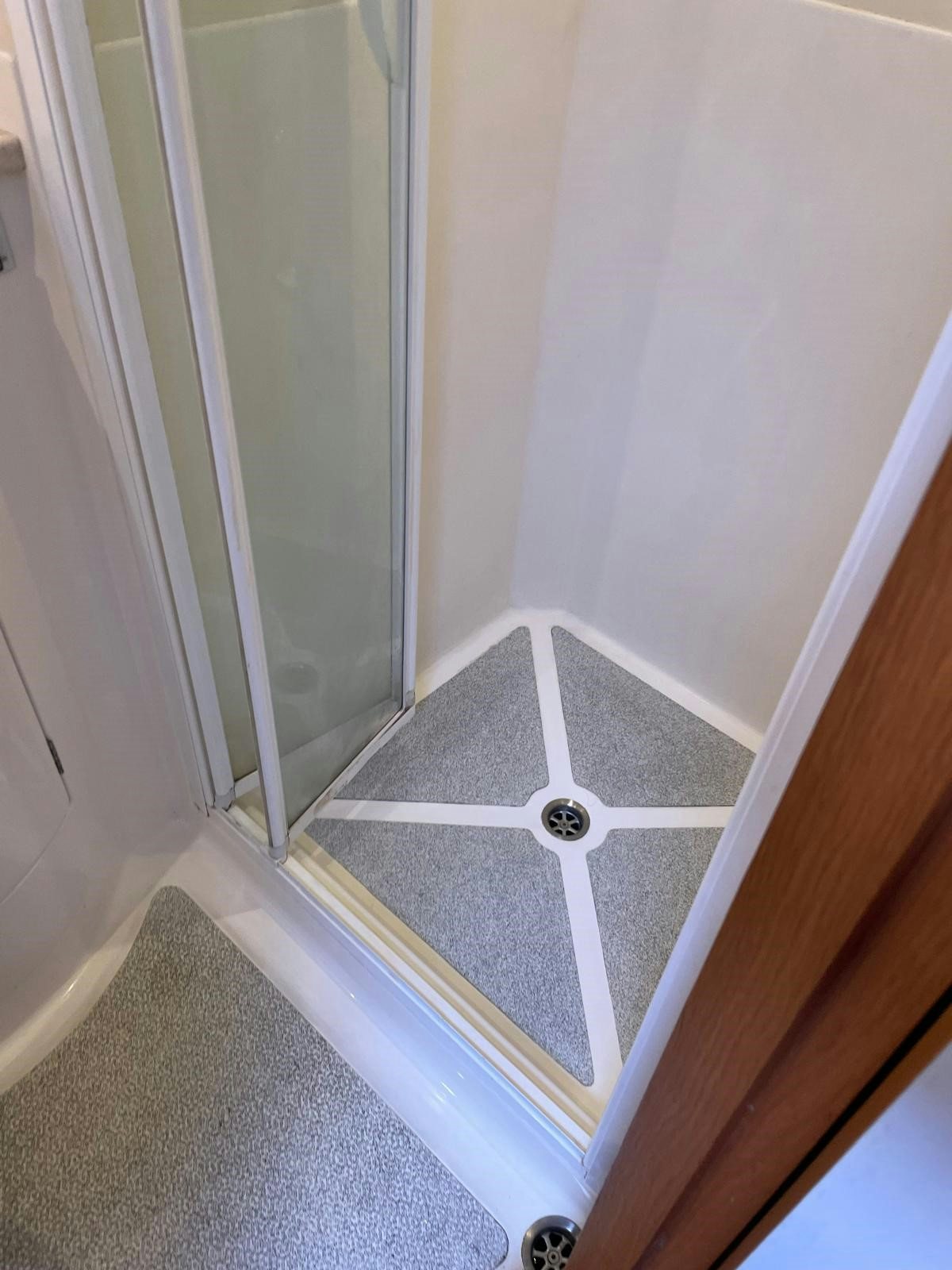 a white door with a glass door aboard DREAM AGAIN II Yacht for Sale