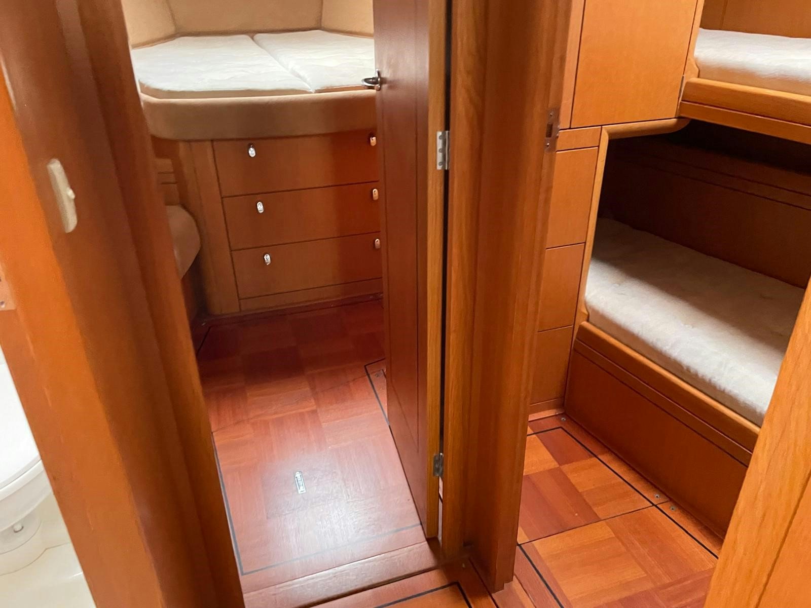 a room with wooden cabinets aboard DREAM AGAIN II Yacht for Sale