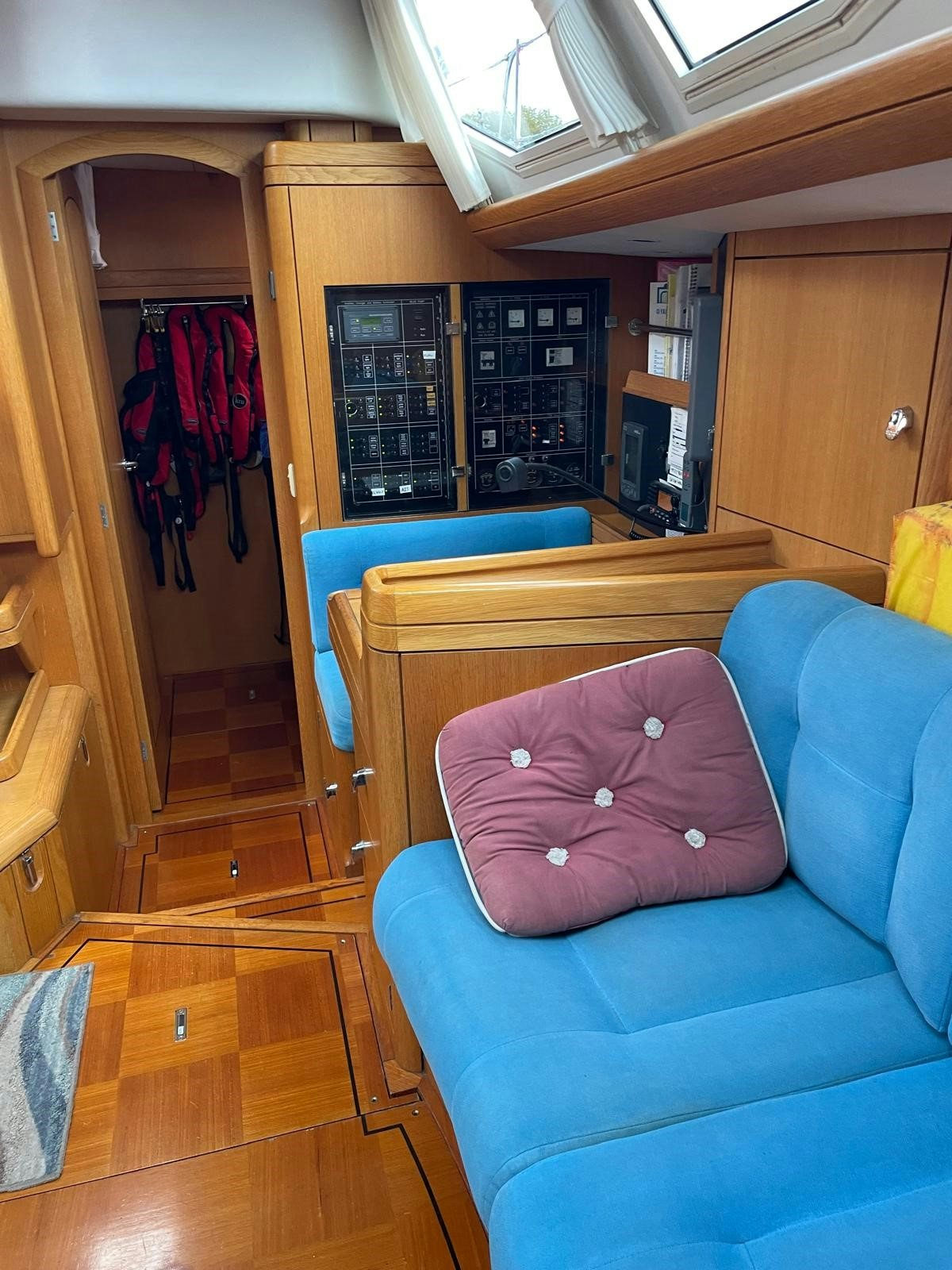 a room with a couch and a closet aboard DREAM AGAIN II Yacht for Sale