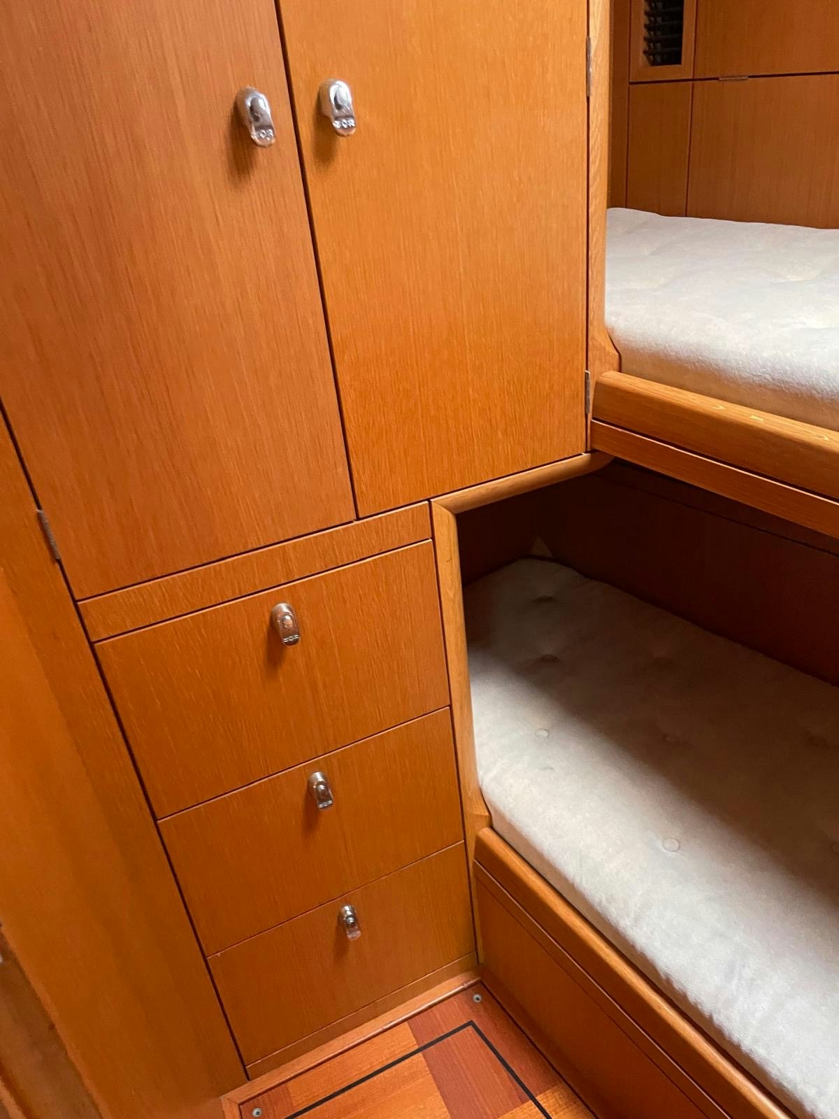 a wooden cabinet with drawers aboard DREAM AGAIN II Yacht for Sale