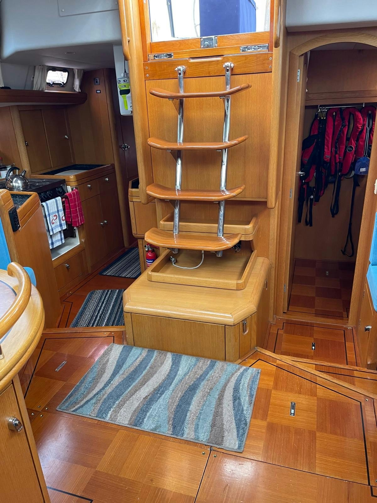 a wooden cabinet with a rug on it aboard DREAM AGAIN II Yacht for Sale