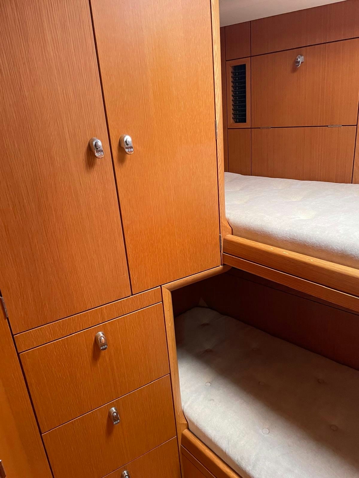 a room with wooden cabinets aboard DREAM AGAIN II Yacht for Sale