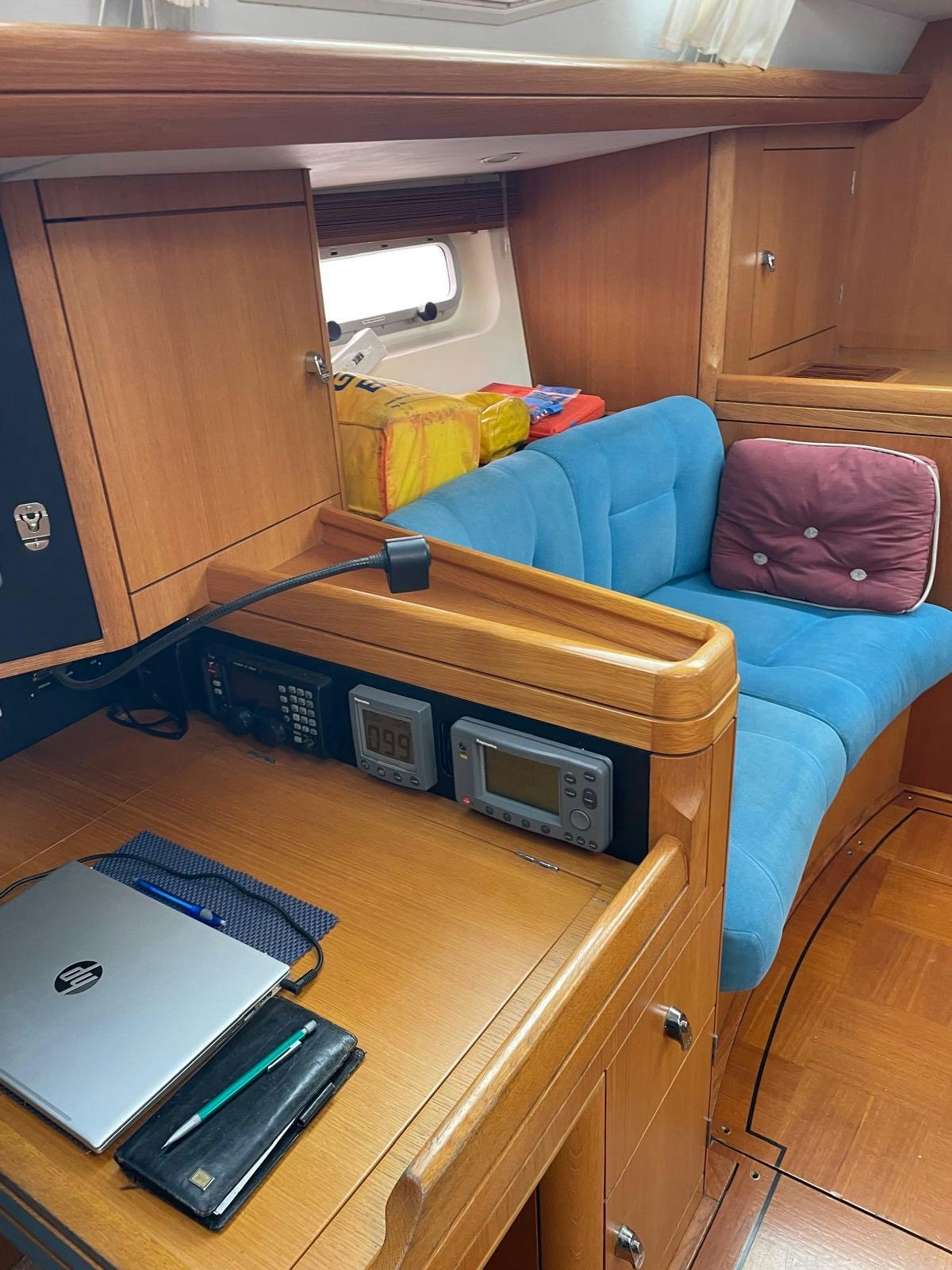 a table with a laptop on it aboard DREAM AGAIN II Yacht for Sale