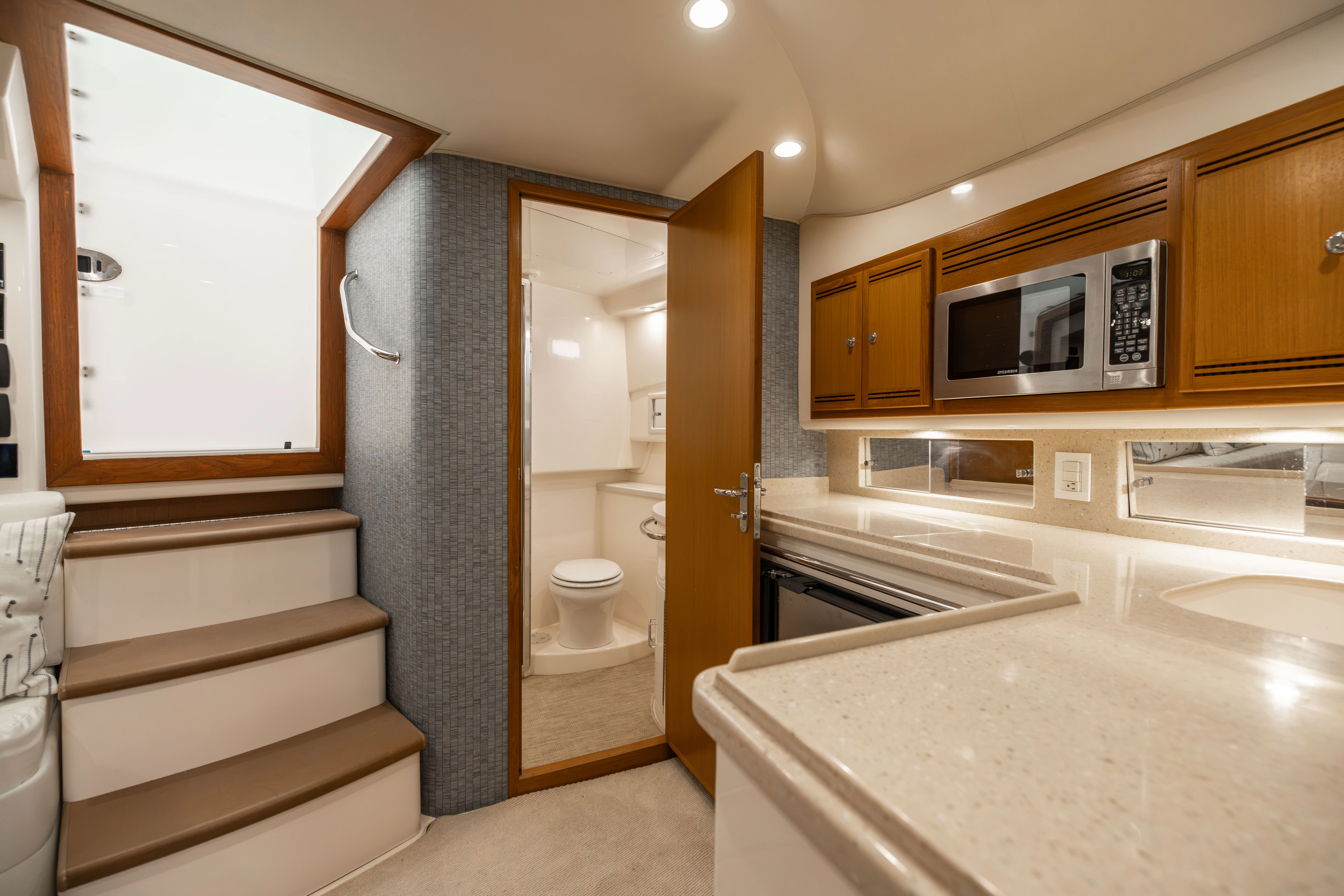 a bathroom with a toilet and a sink aboard SHOW TIME Yacht for Sale