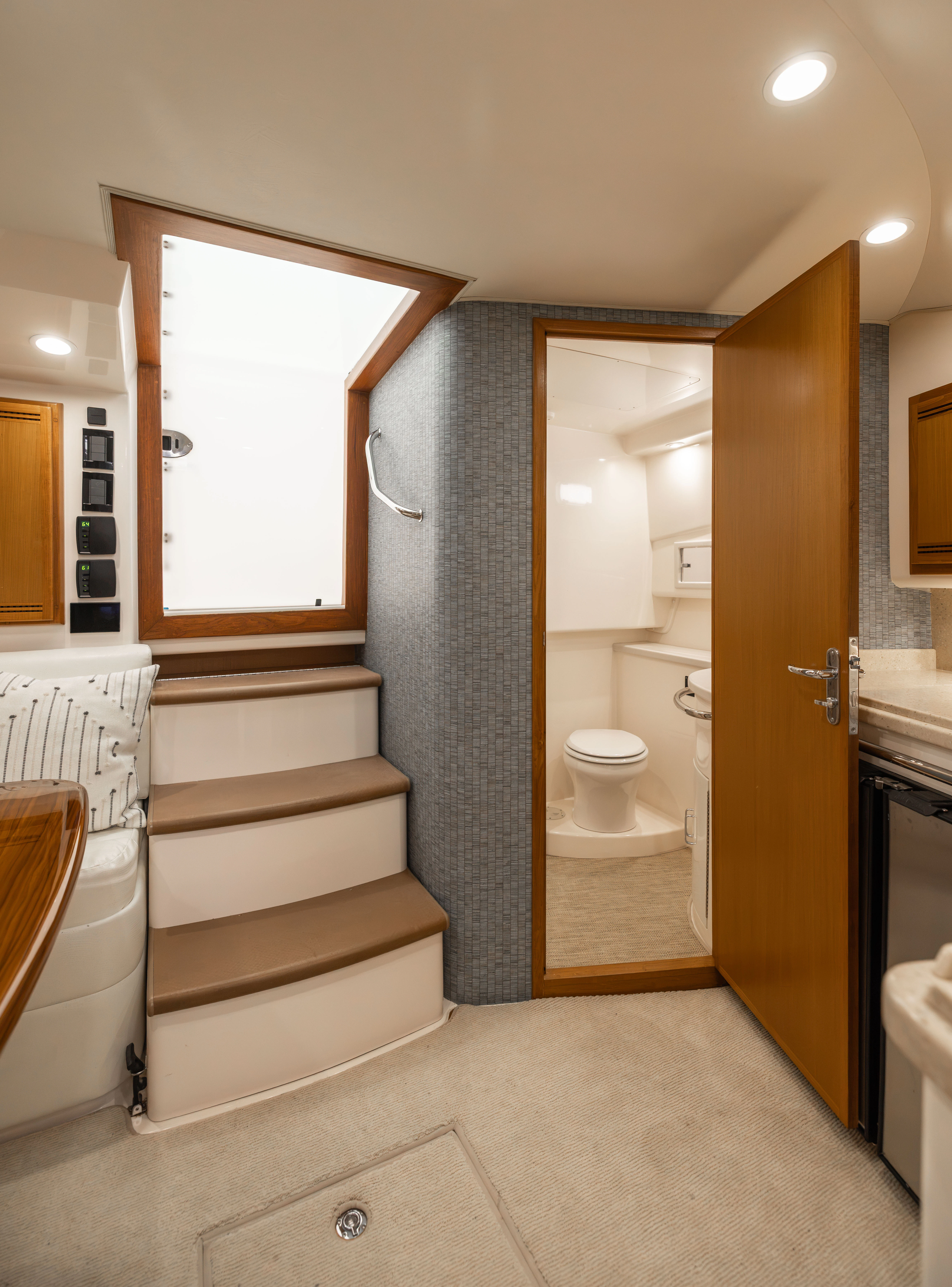 a bathroom with a toilet and a sink aboard SHOW TIME Yacht for Sale