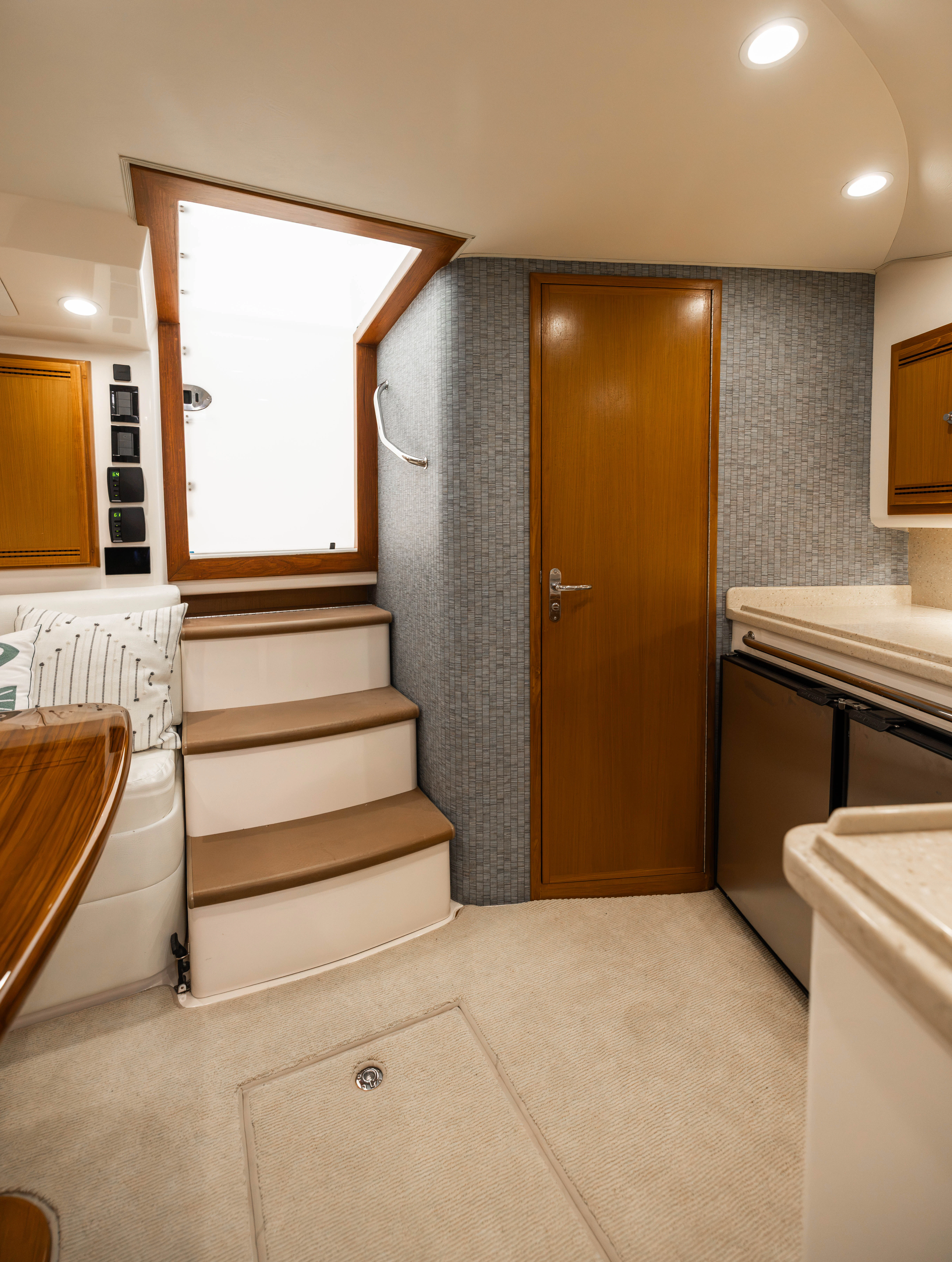 a bathroom with a door and a tub aboard SHOW TIME Yacht for Sale