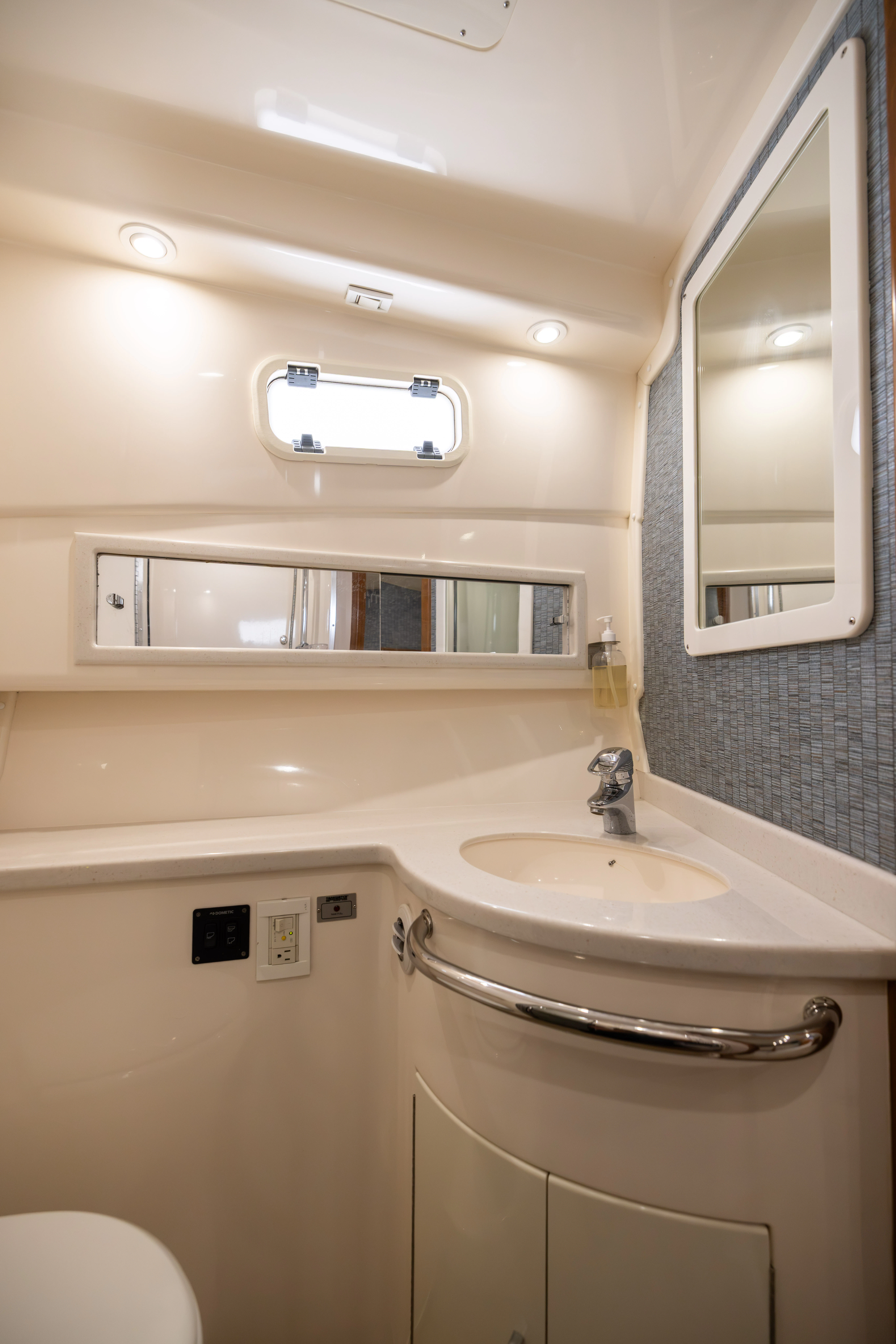 a bathroom with a sink and a mirror aboard SHOW TIME Yacht for Sale