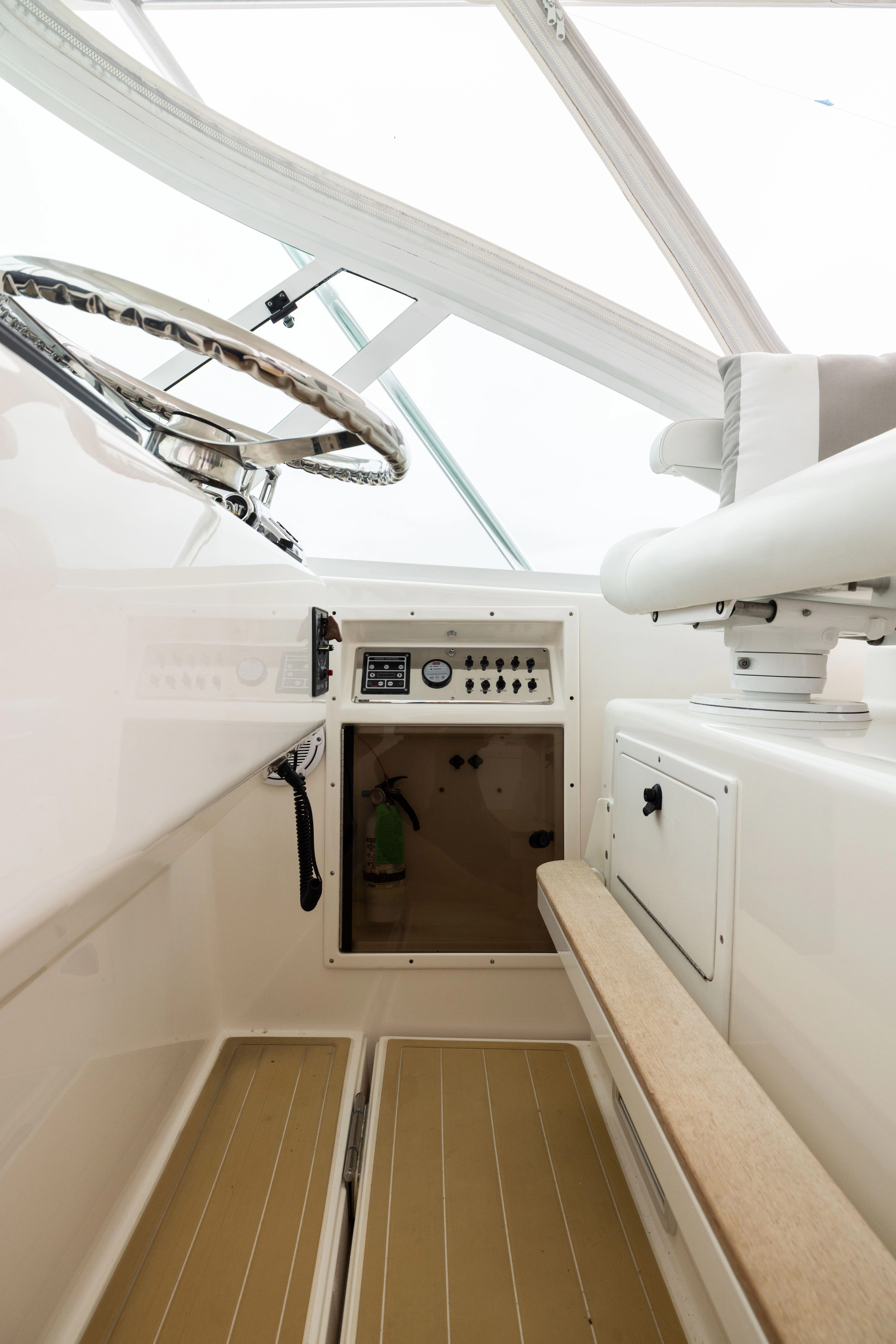 a white room with a ceiling fan aboard SHOW TIME Yacht for Sale