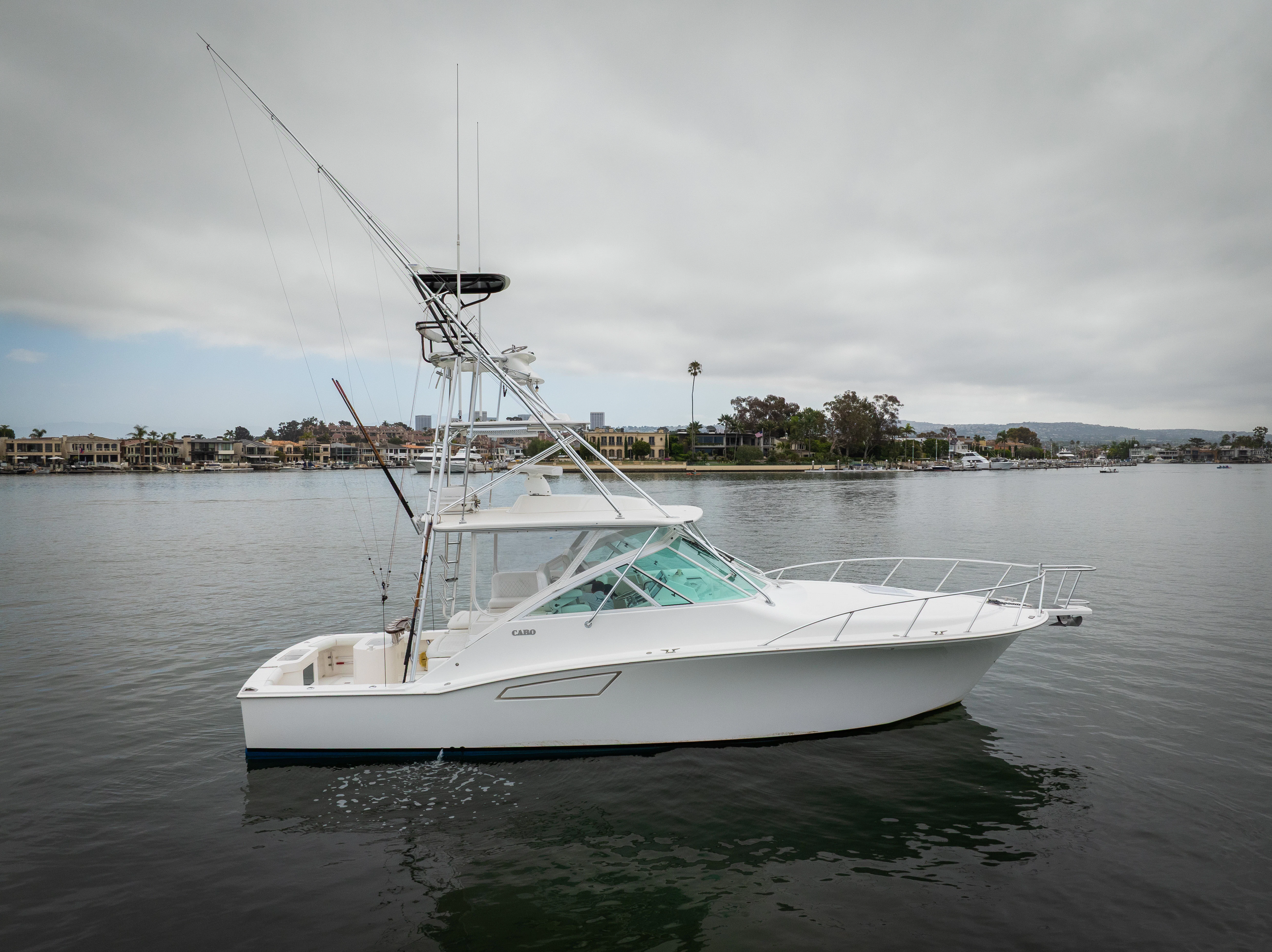 a white boat in the water aboard SHOW TIME Yacht for Sale