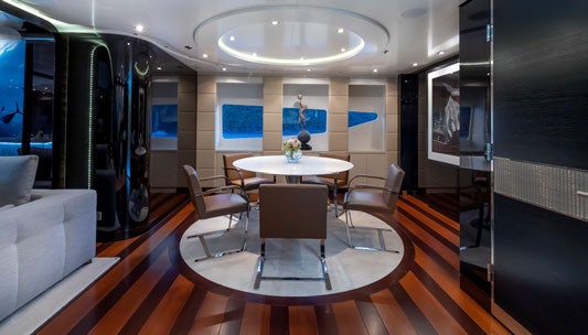 a room with a table and chairs aboard SCOTT FREE Yacht for Charter