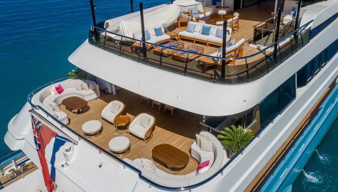 a large boat with lounge chairs aboard SCOTT FREE Yacht for Charter
