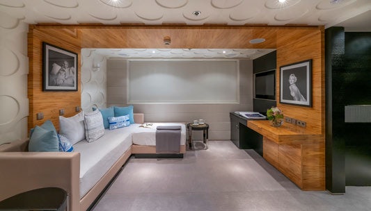 a room with a bed and a desk aboard SCOTT FREE Yacht for Charter