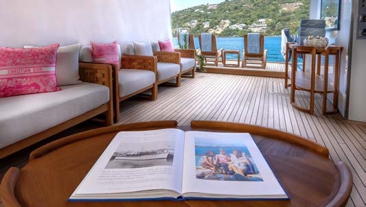 a living room with a table and chairs aboard SCOTT FREE Yacht for Charter