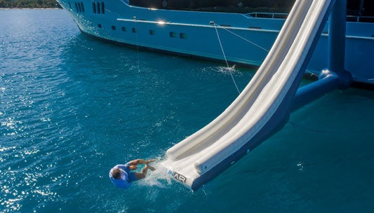 a person swimming in a body of water aboard SCOTT FREE Yacht for Charter