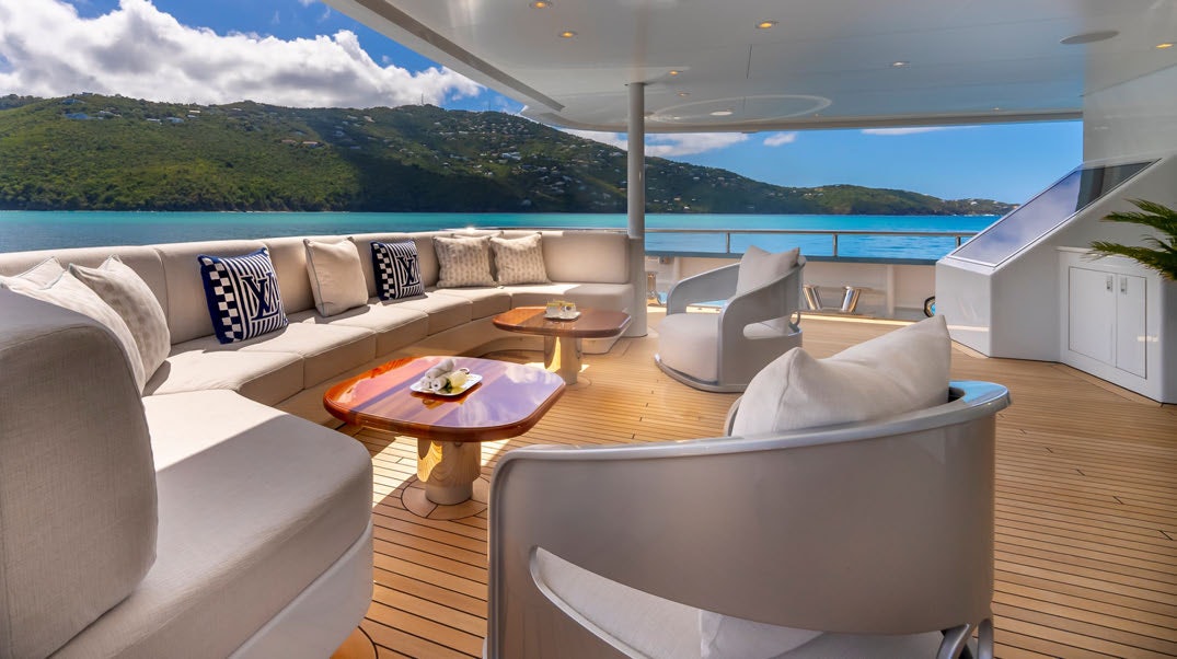a living room with a large patio aboard SCOTT FREE Yacht for Charter