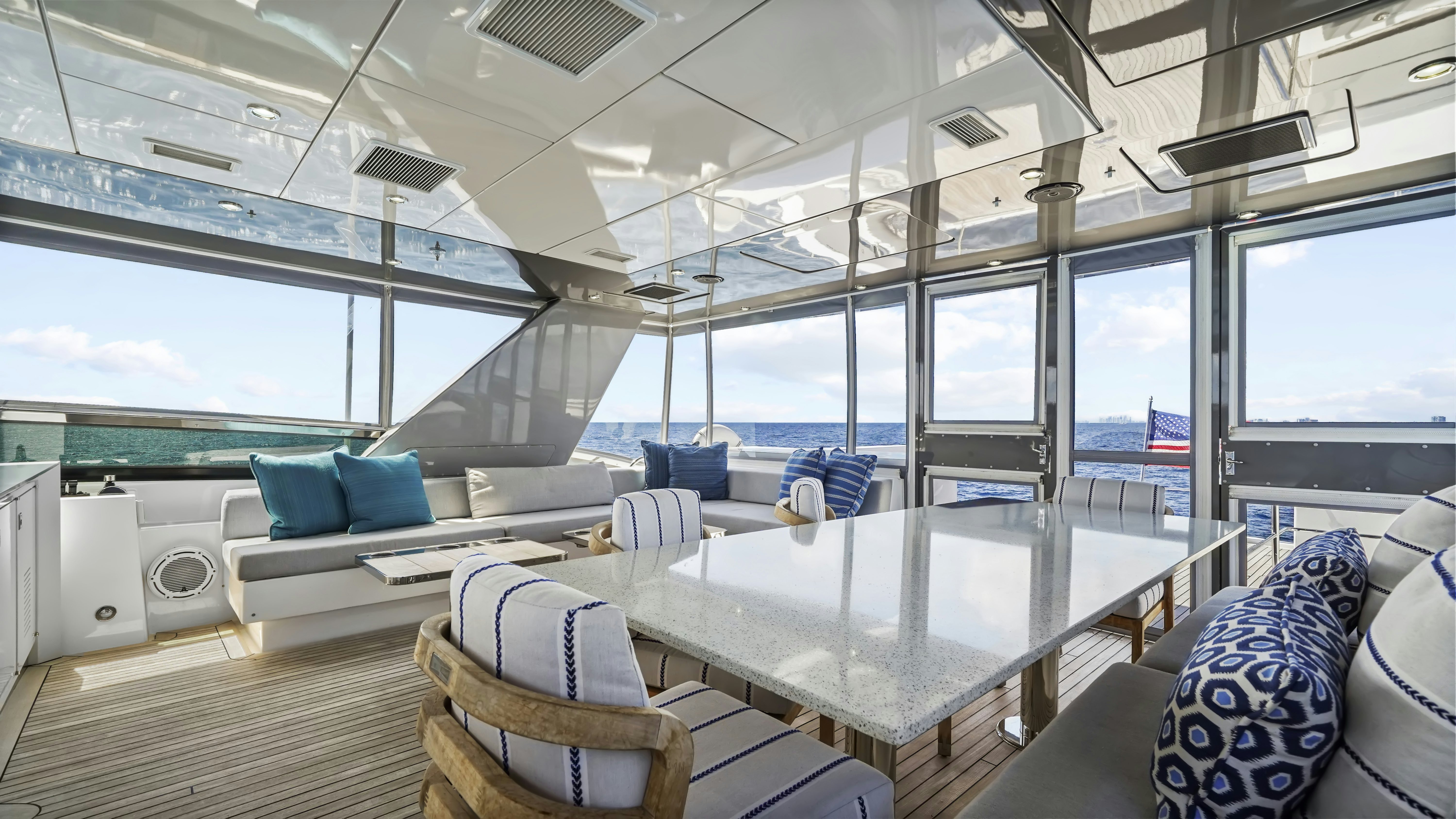 a room with a table chairs and a large window aboard SURPLUS LINES Yacht for Sale