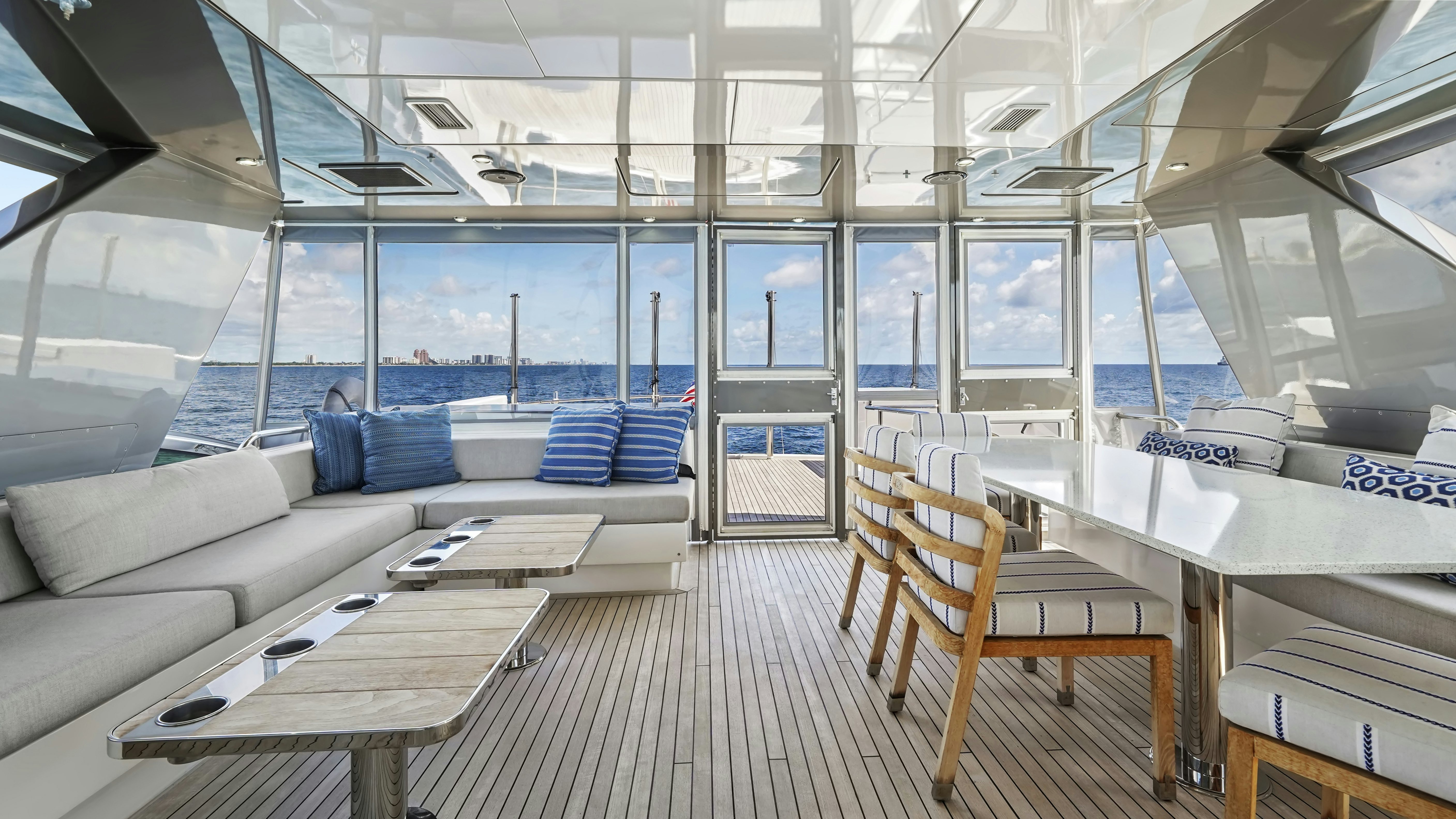 a room with a couch and a table and chairs aboard SURPLUS LINES Yacht for Sale