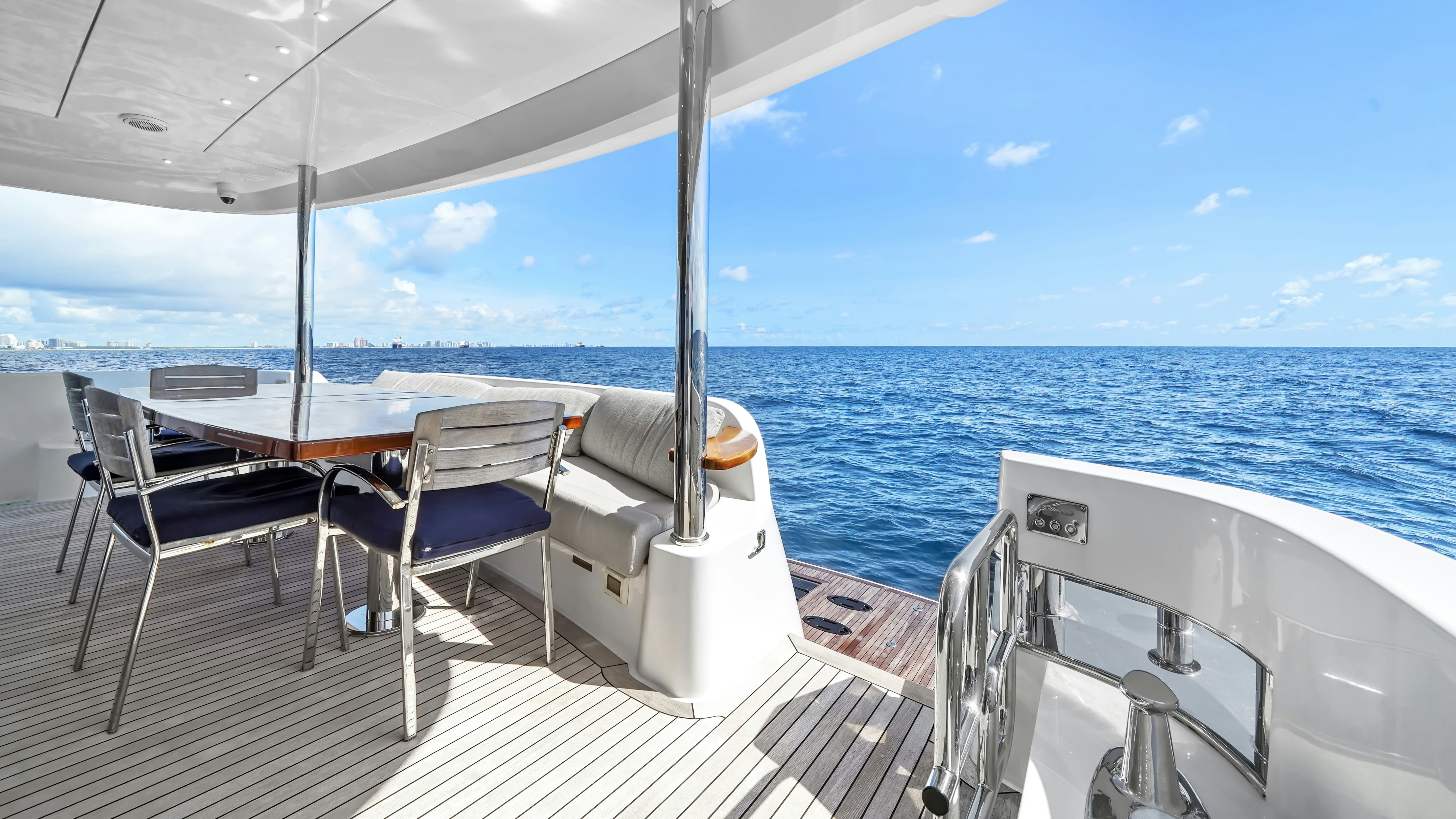 a deck with chairs and a body of water aboard SURPLUS LINES Yacht for Sale