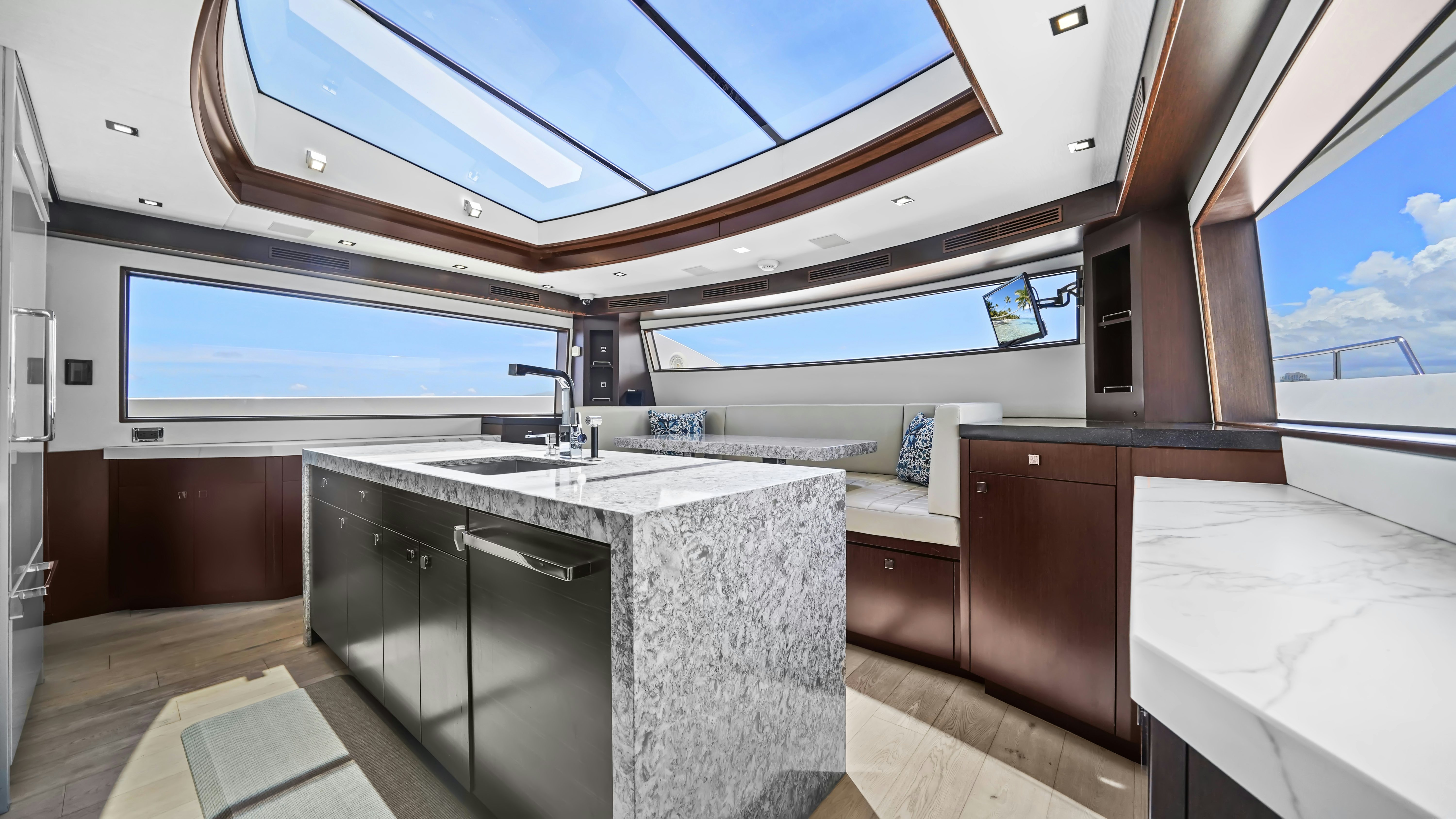 a kitchen with a large window aboard SURPLUS LINES Yacht for Sale