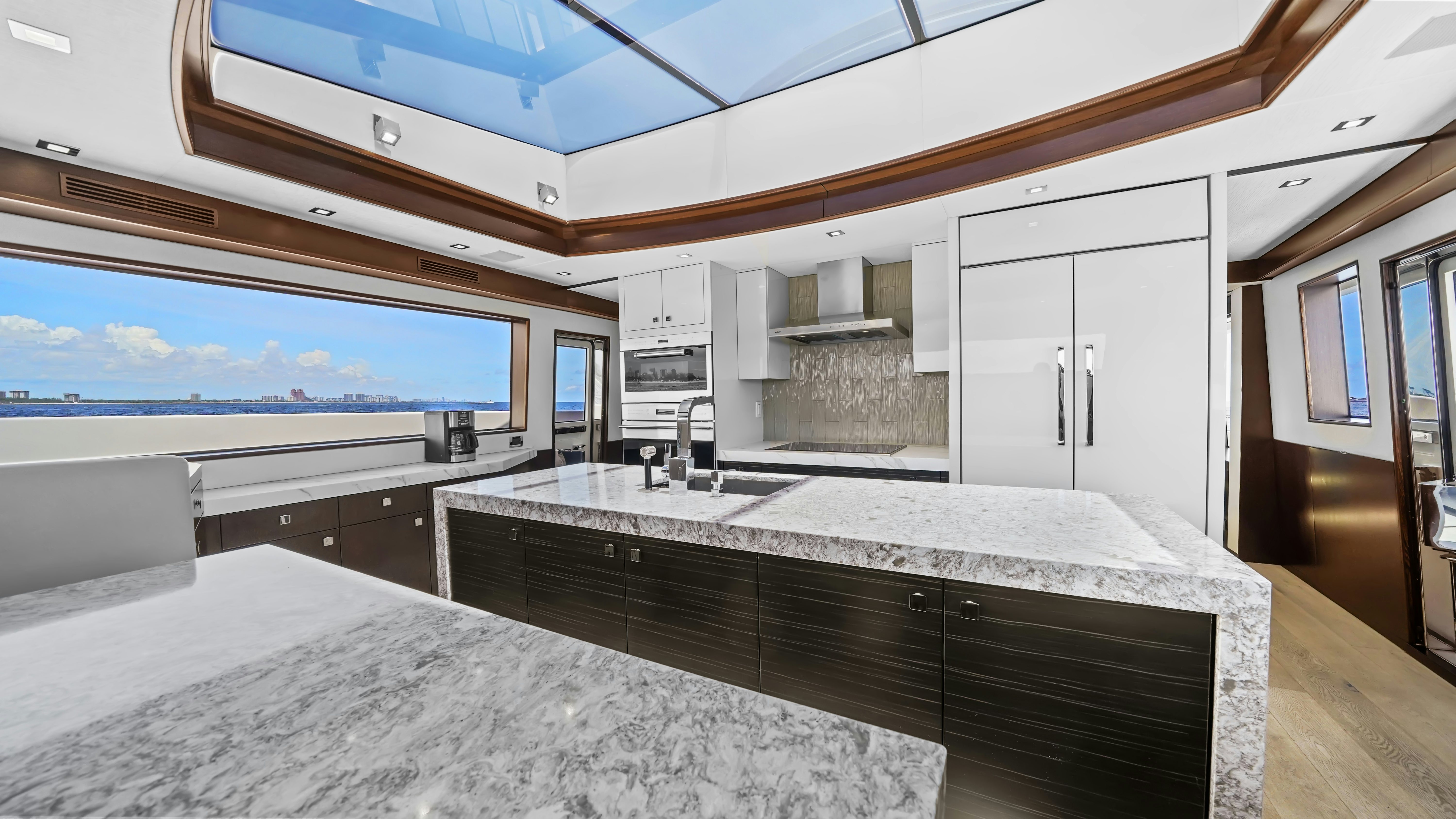 a large kitchen with a large window aboard SURPLUS LINES Yacht for Sale