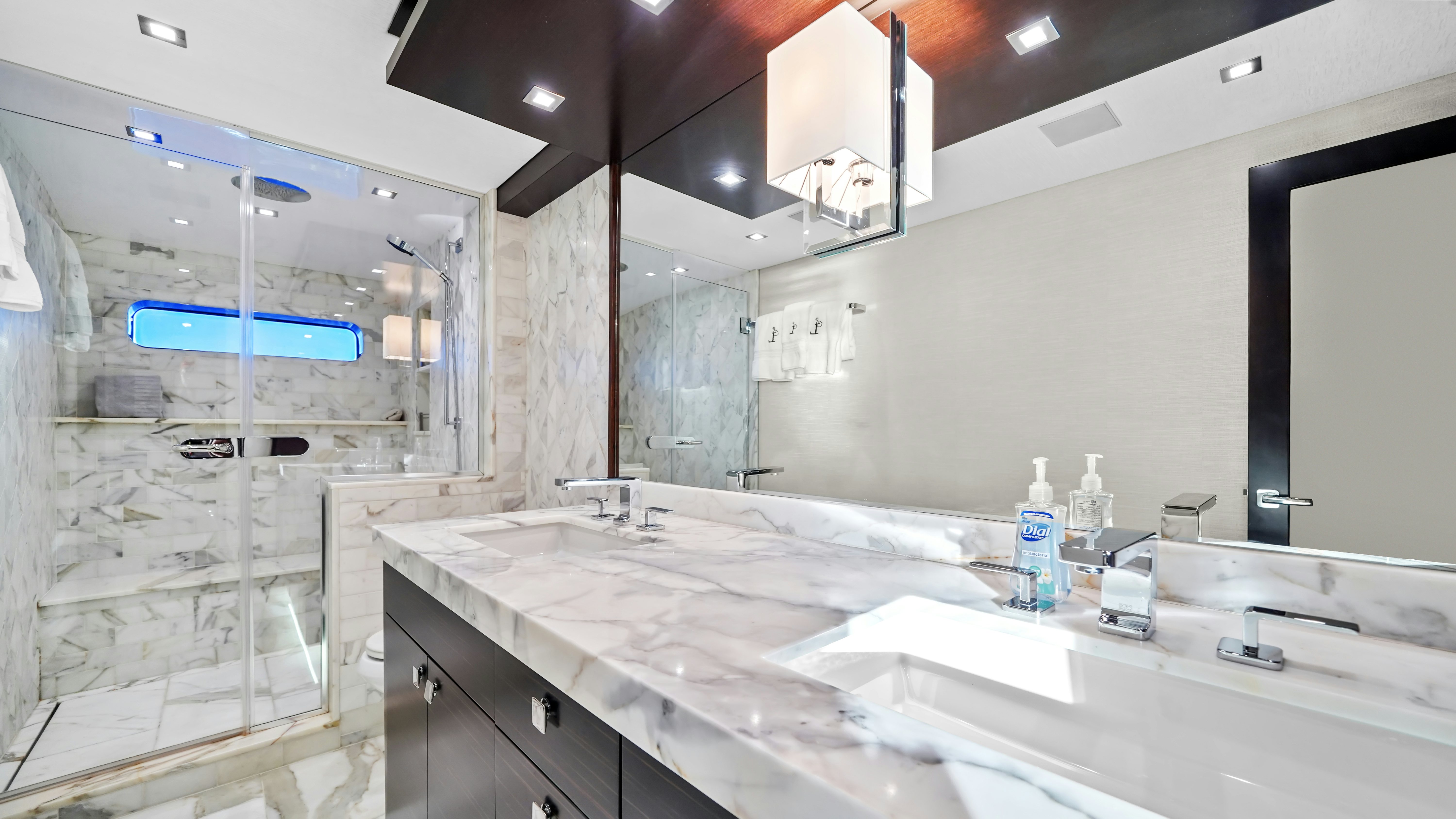 a bathroom with a large mirror aboard SURPLUS LINES Yacht for Sale