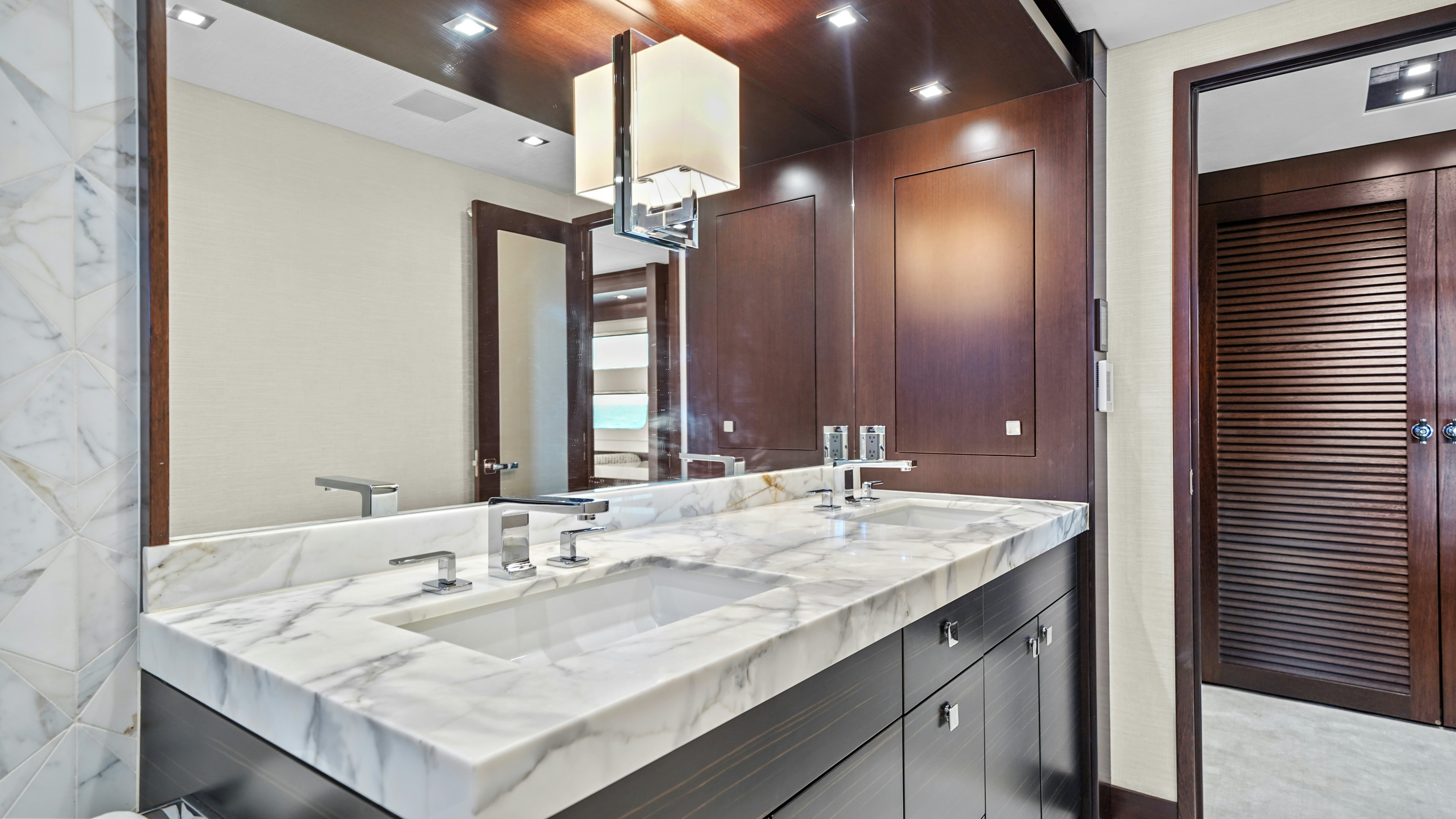 a bathroom with a large mirror aboard SURPLUS LINES Yacht for Sale