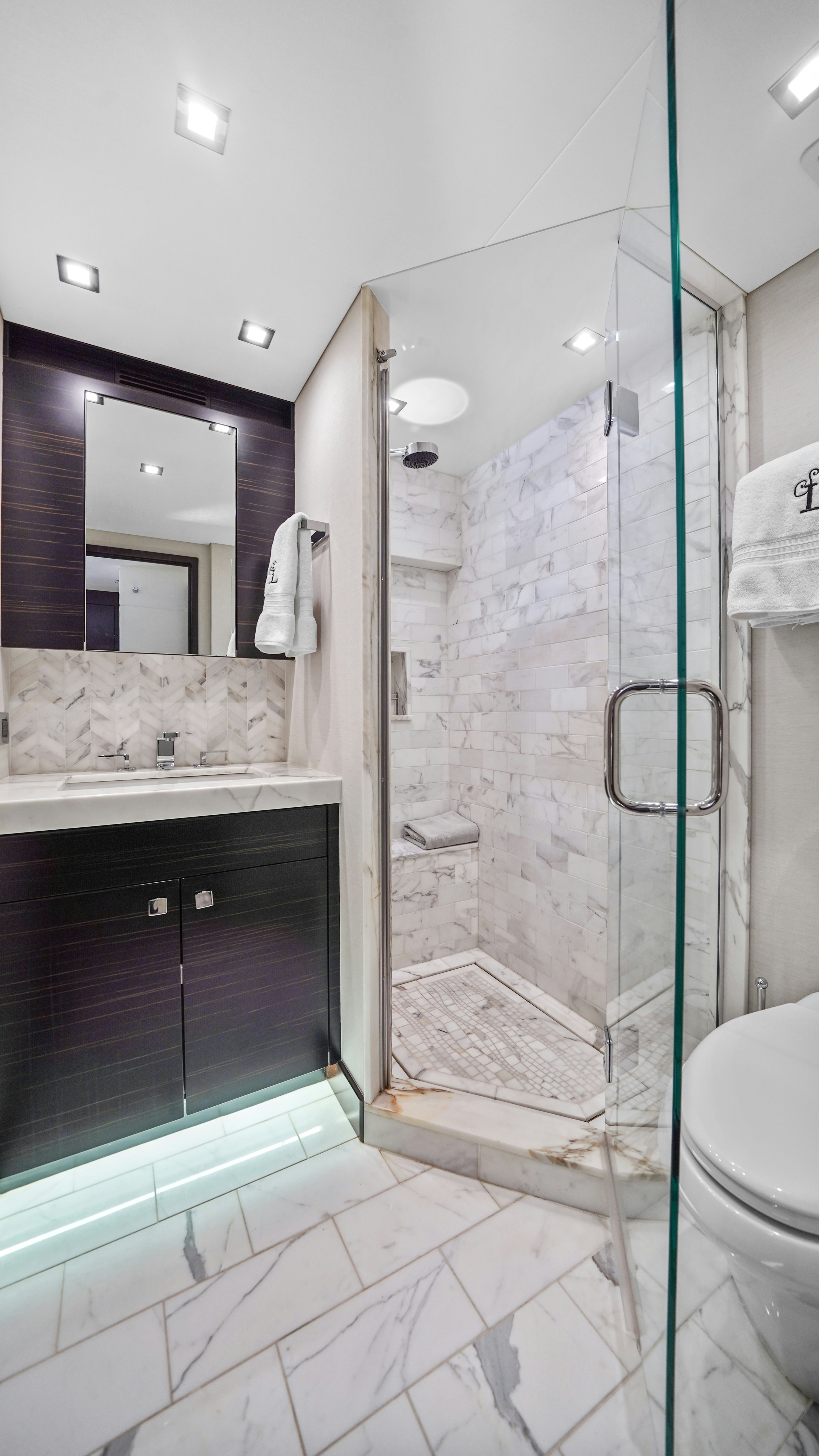 a bathroom with a shower unit and a sink aboard SURPLUS LINES Yacht for Sale