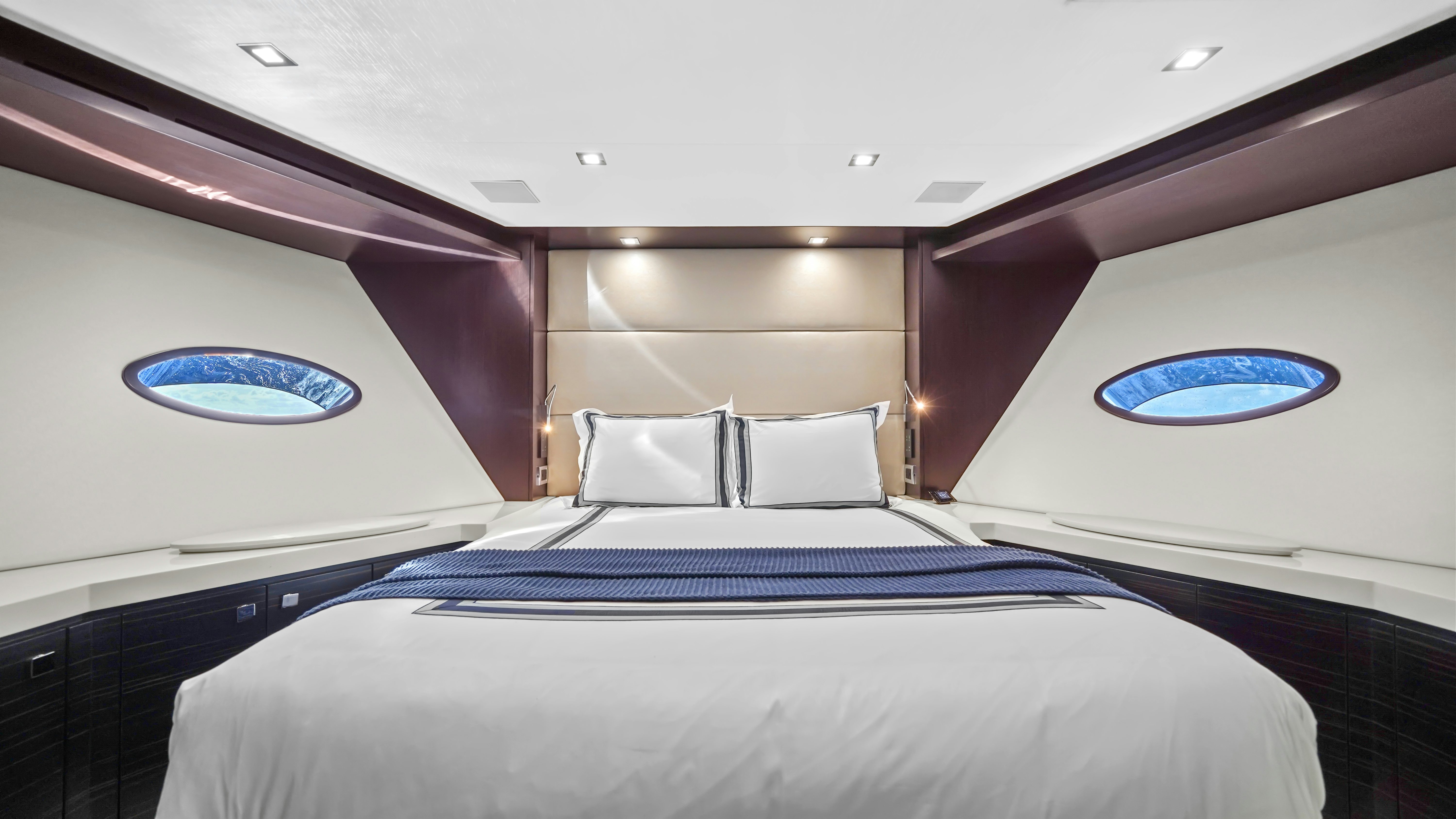 a bed with a blue blanket aboard SURPLUS LINES Yacht for Sale