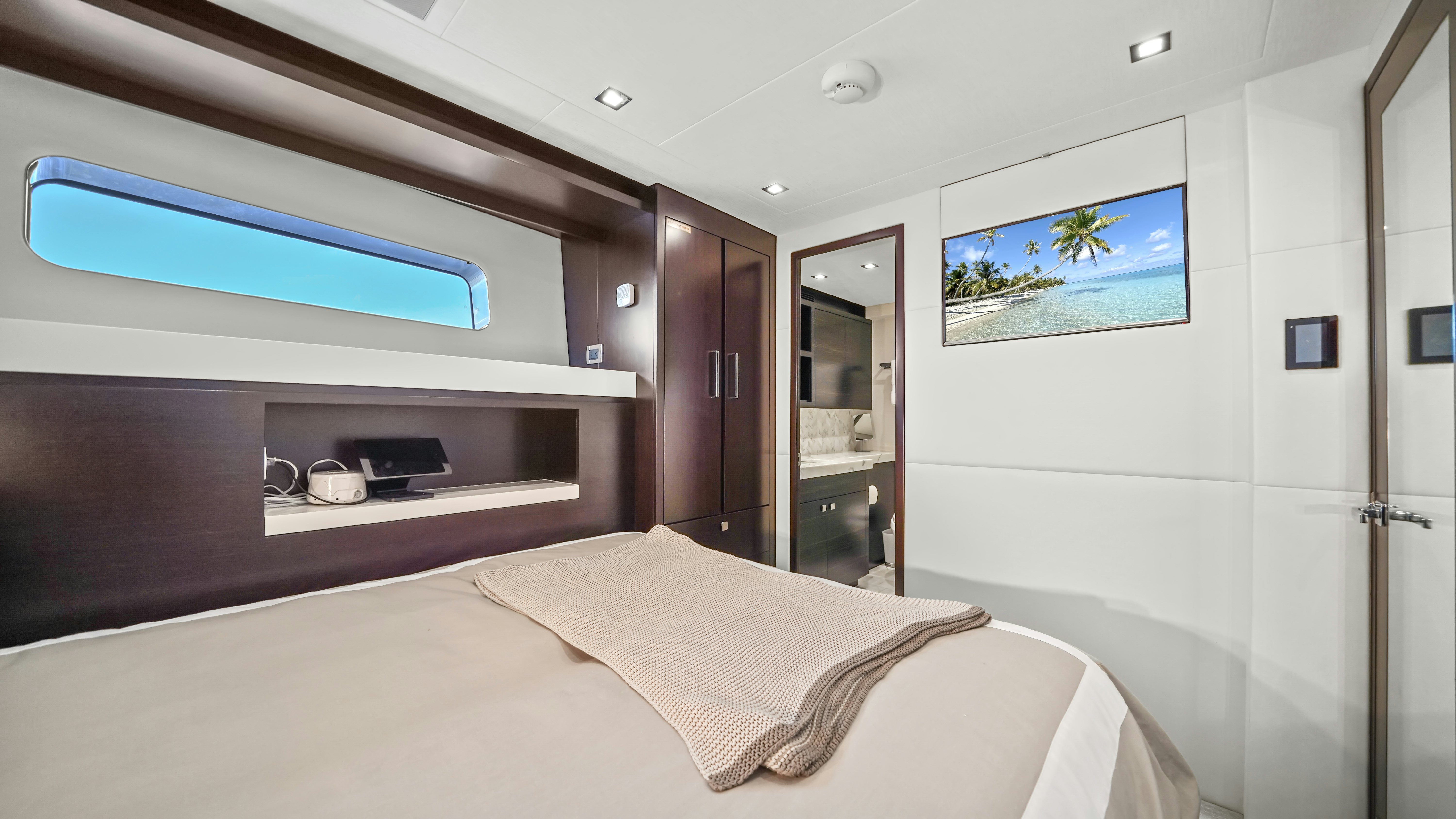 a room with a bed and a television aboard SURPLUS LINES Yacht for Sale