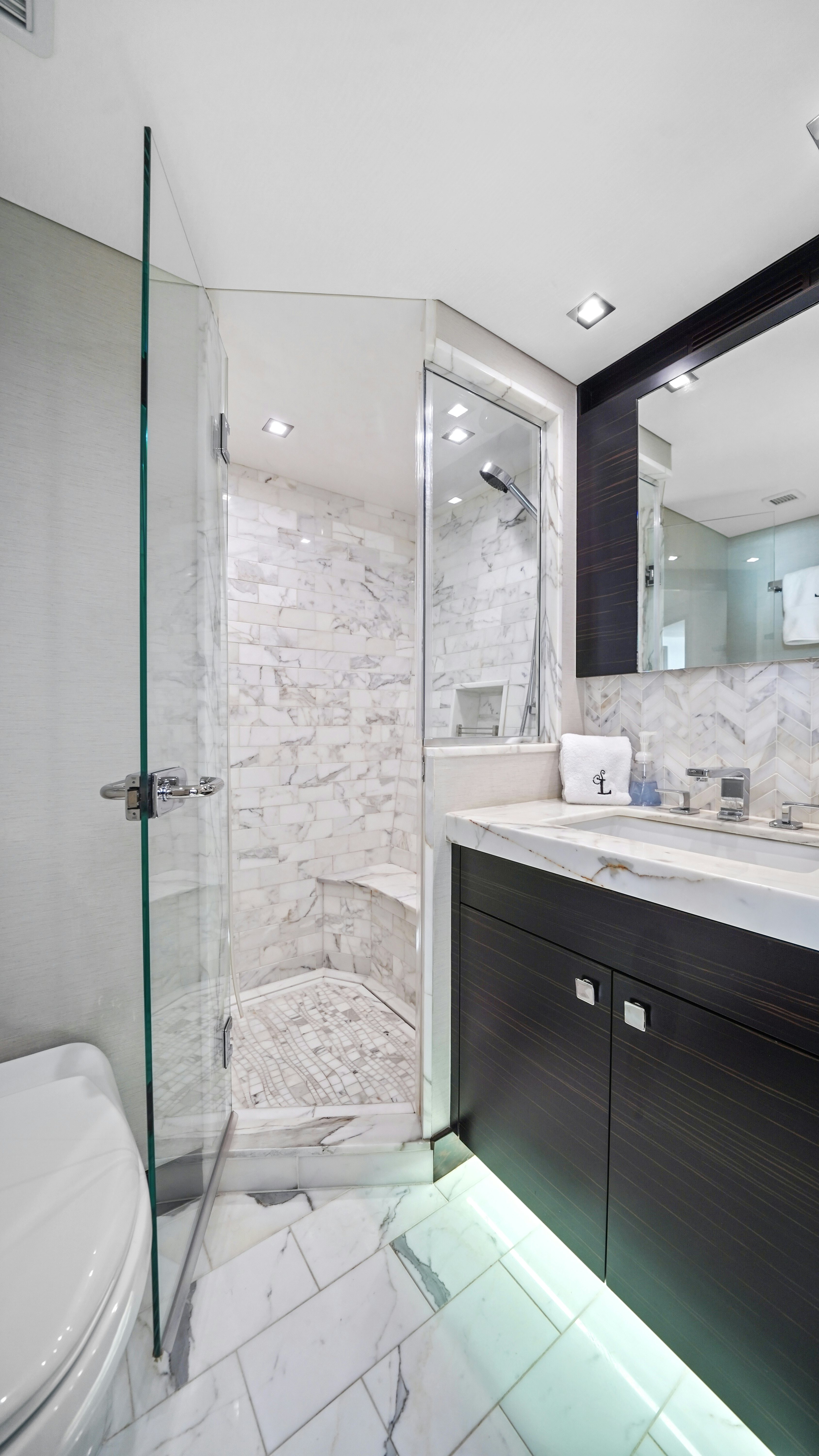 a bathroom with a shower unit and sink aboard SURPLUS LINES Yacht for Sale