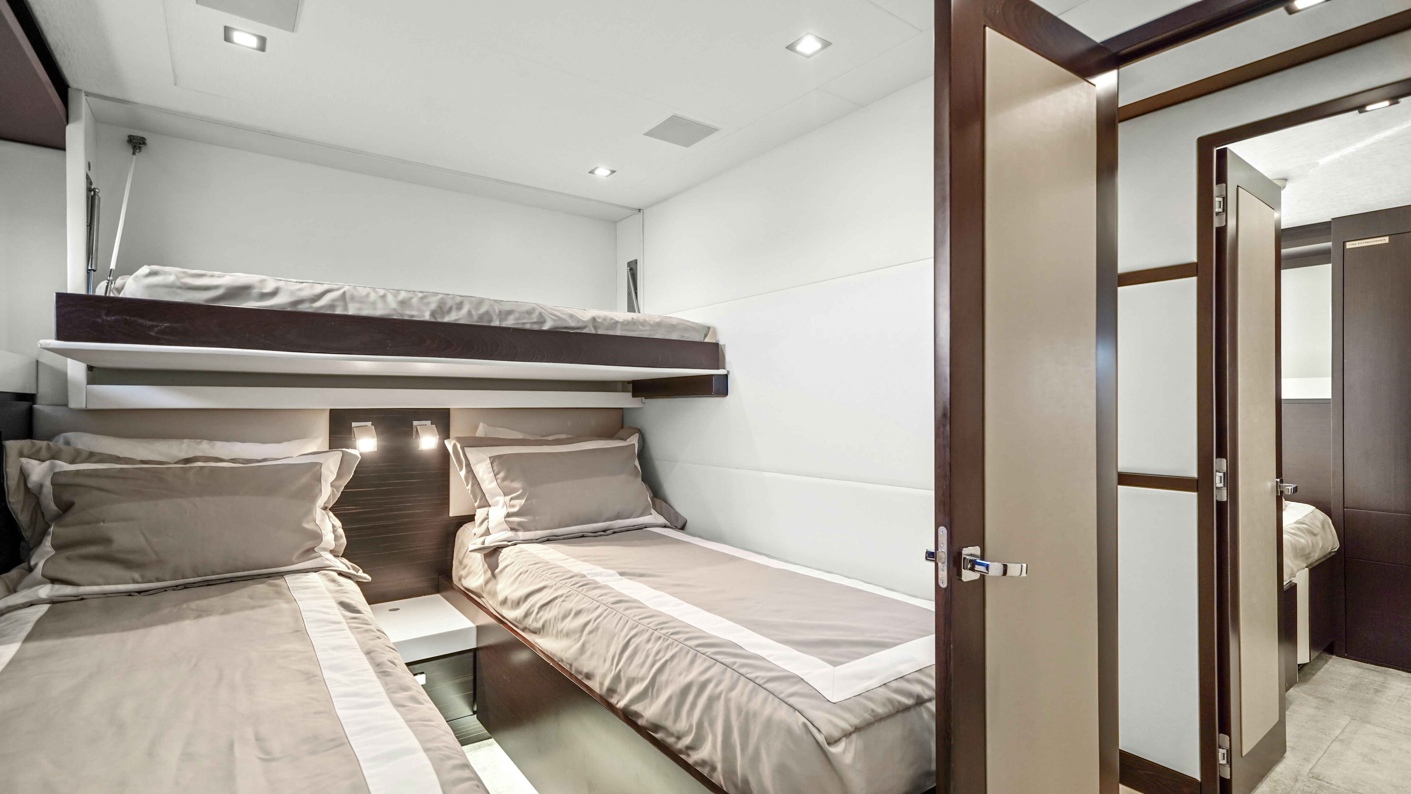 a room with a couple of beds aboard SURPLUS LINES Yacht for Sale