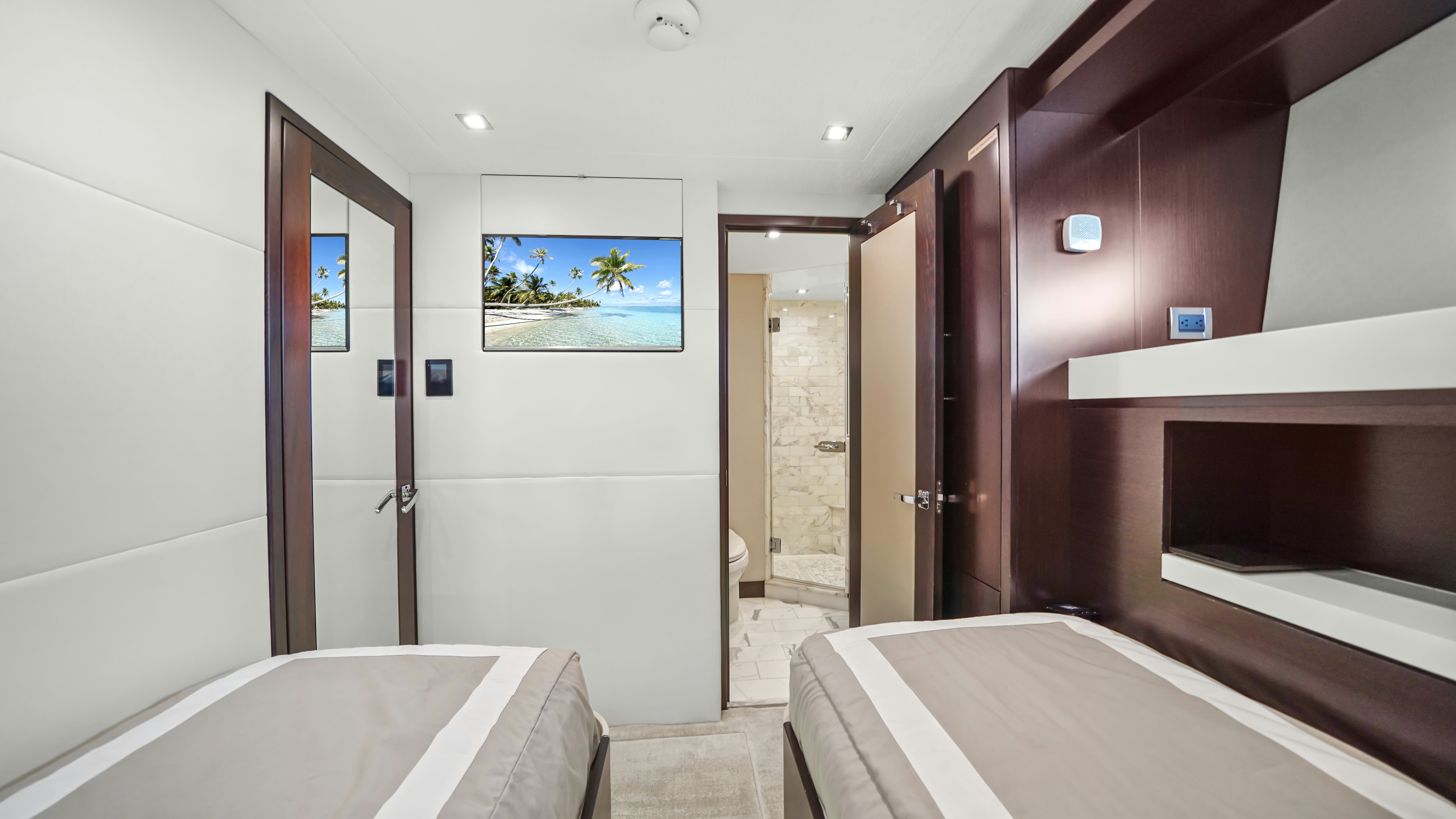 a bathroom with a bathtub and a large mirror aboard SURPLUS LINES Yacht for Sale