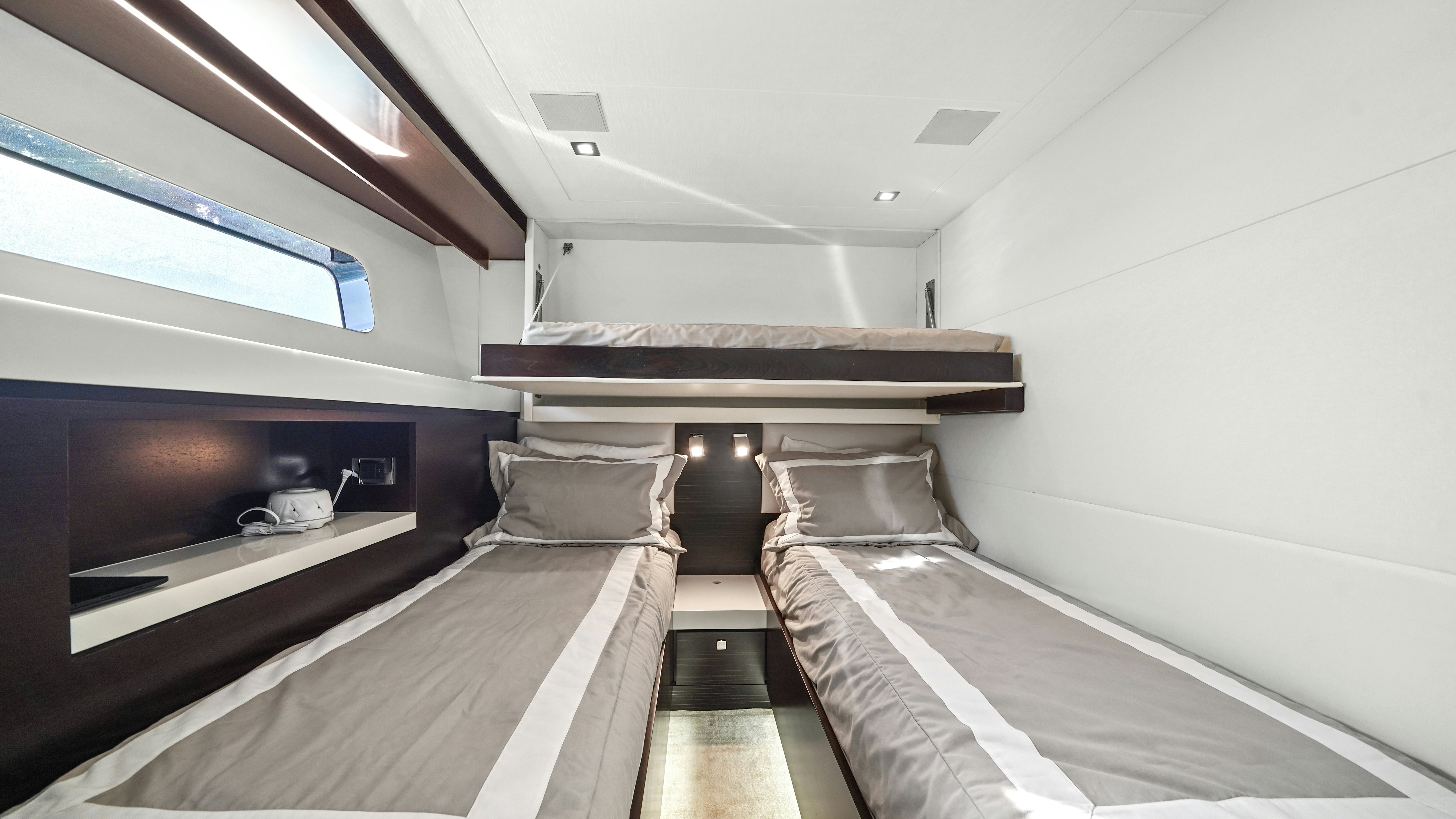 a room with a bed and a television aboard SURPLUS LINES Yacht for Sale