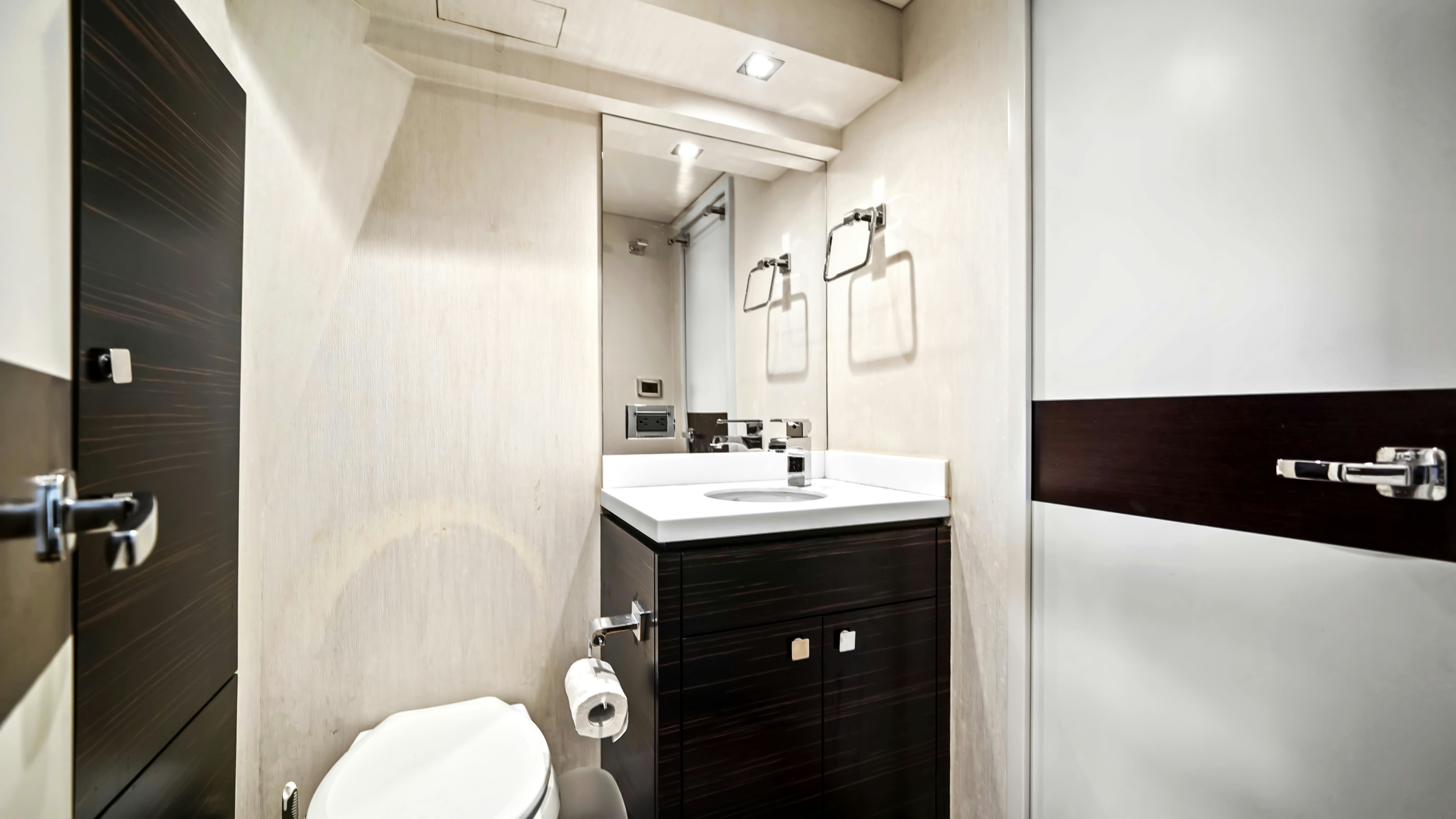 a bathroom with a toilet and sink aboard SURPLUS LINES Yacht for Sale