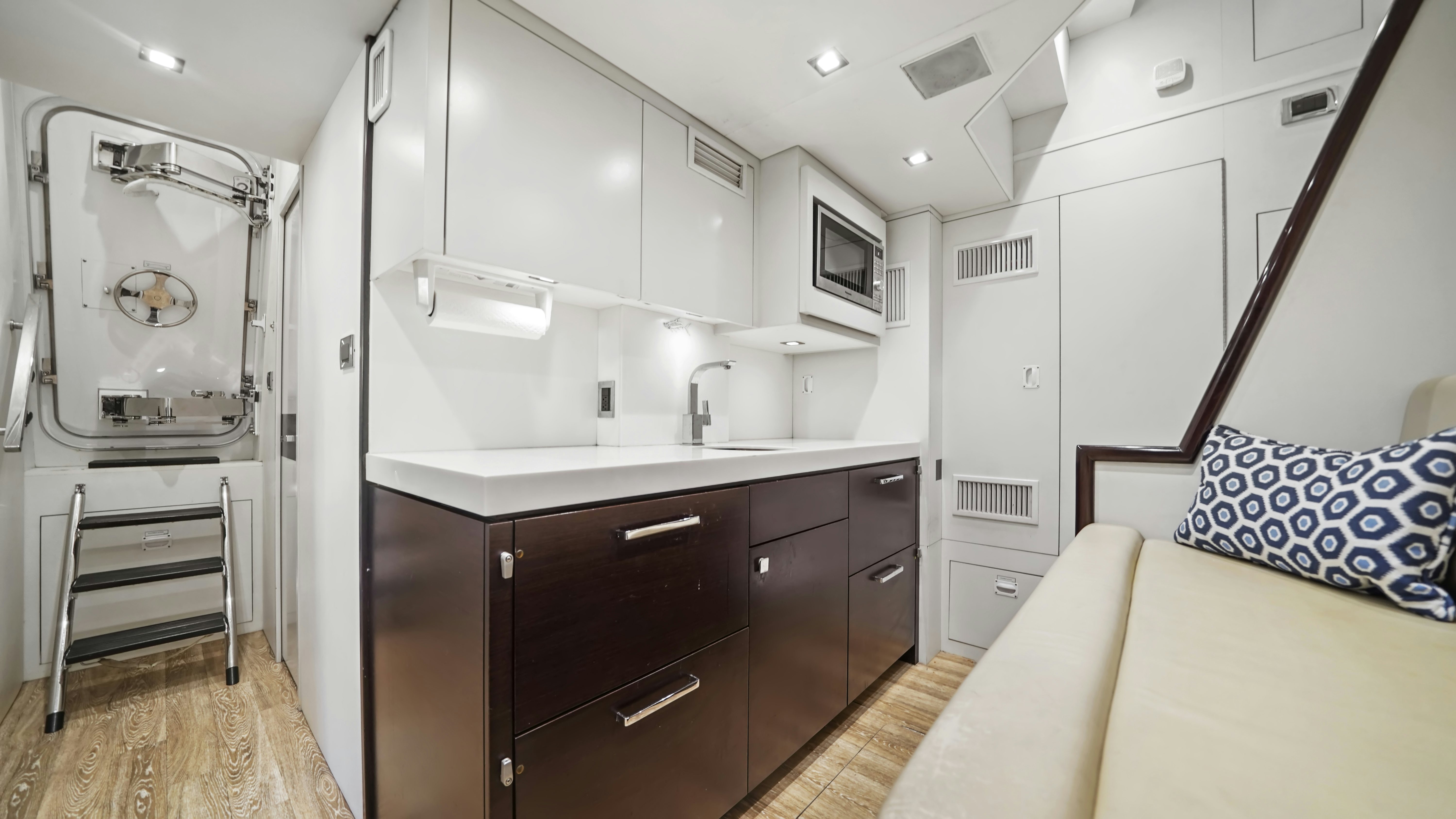 a bedroom with a bed and a sink aboard SURPLUS LINES Yacht for Sale