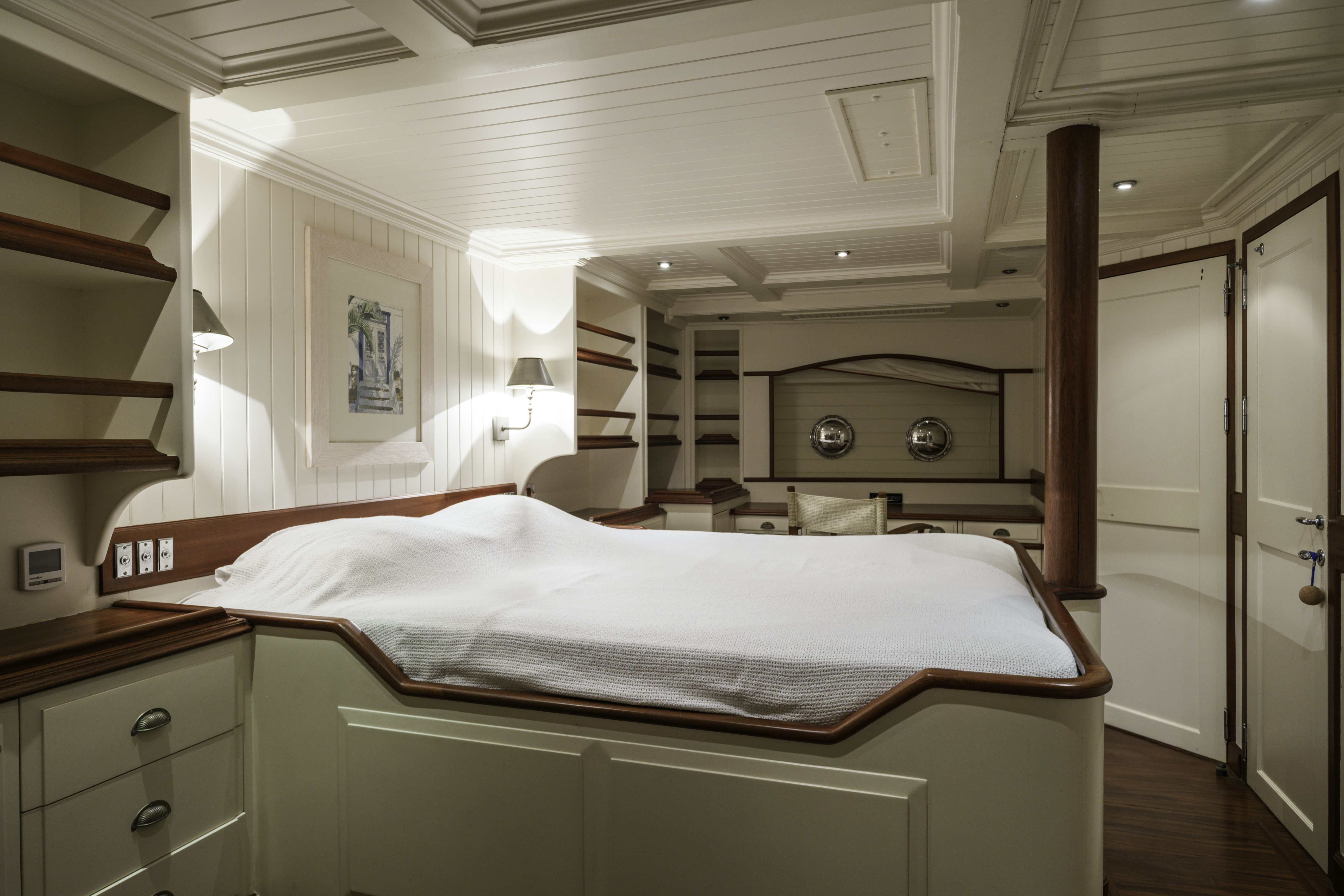 a room with a bed and a ladder aboard STRANGERS IN THE NIGHT Yacht for Sale